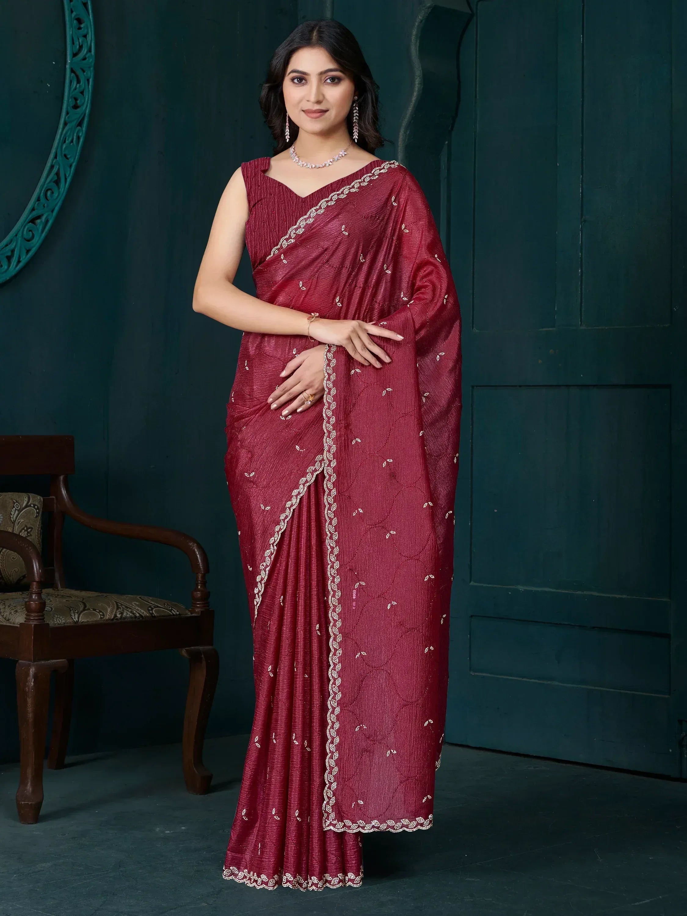 Woman in maroon ethnic saree with white embroidery, perfect for Indian occasions and festive wear.