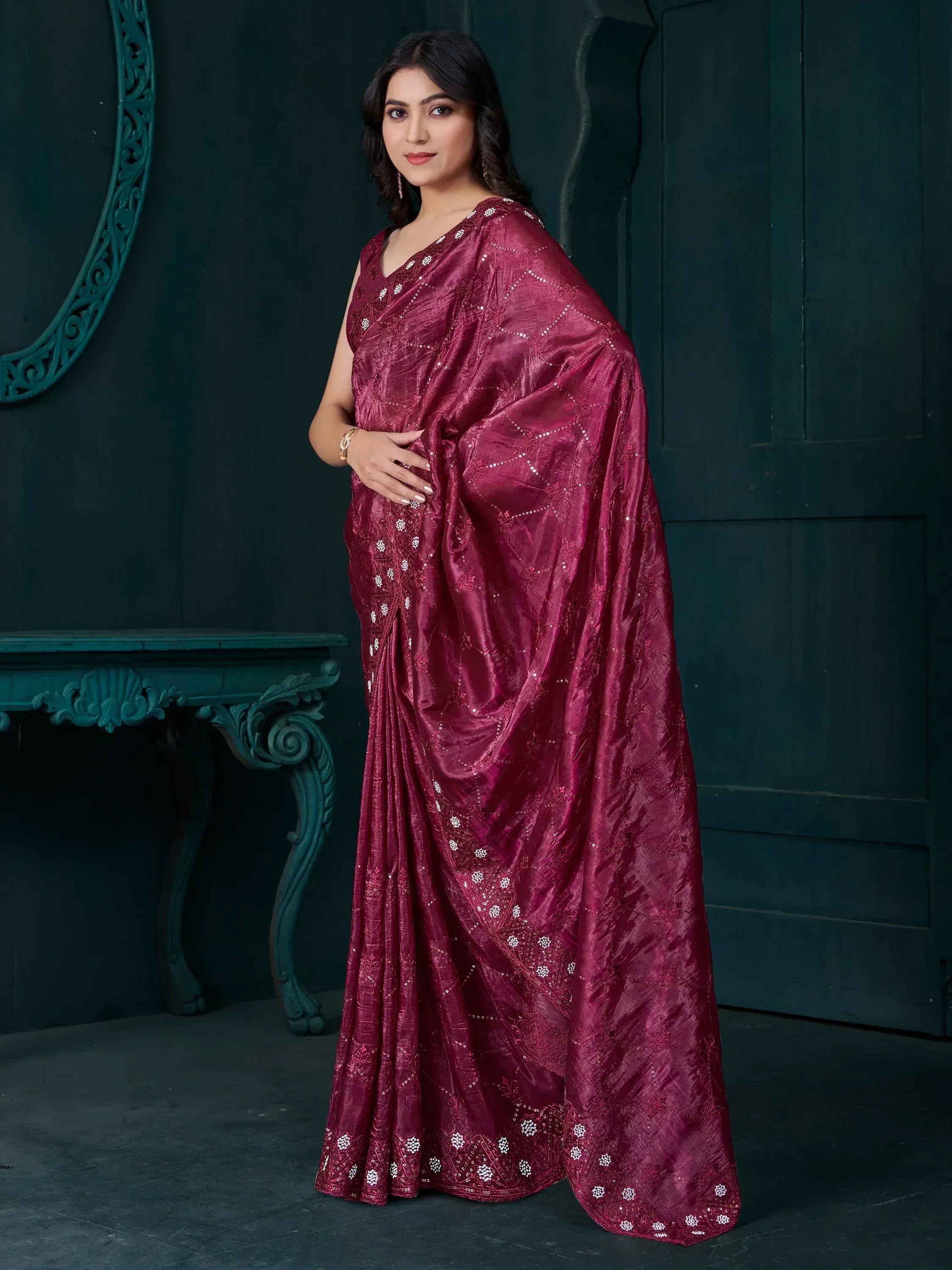 Elegant maroon saree with intricate white embroidery and shimmering details, perfect for ethnic occasions.