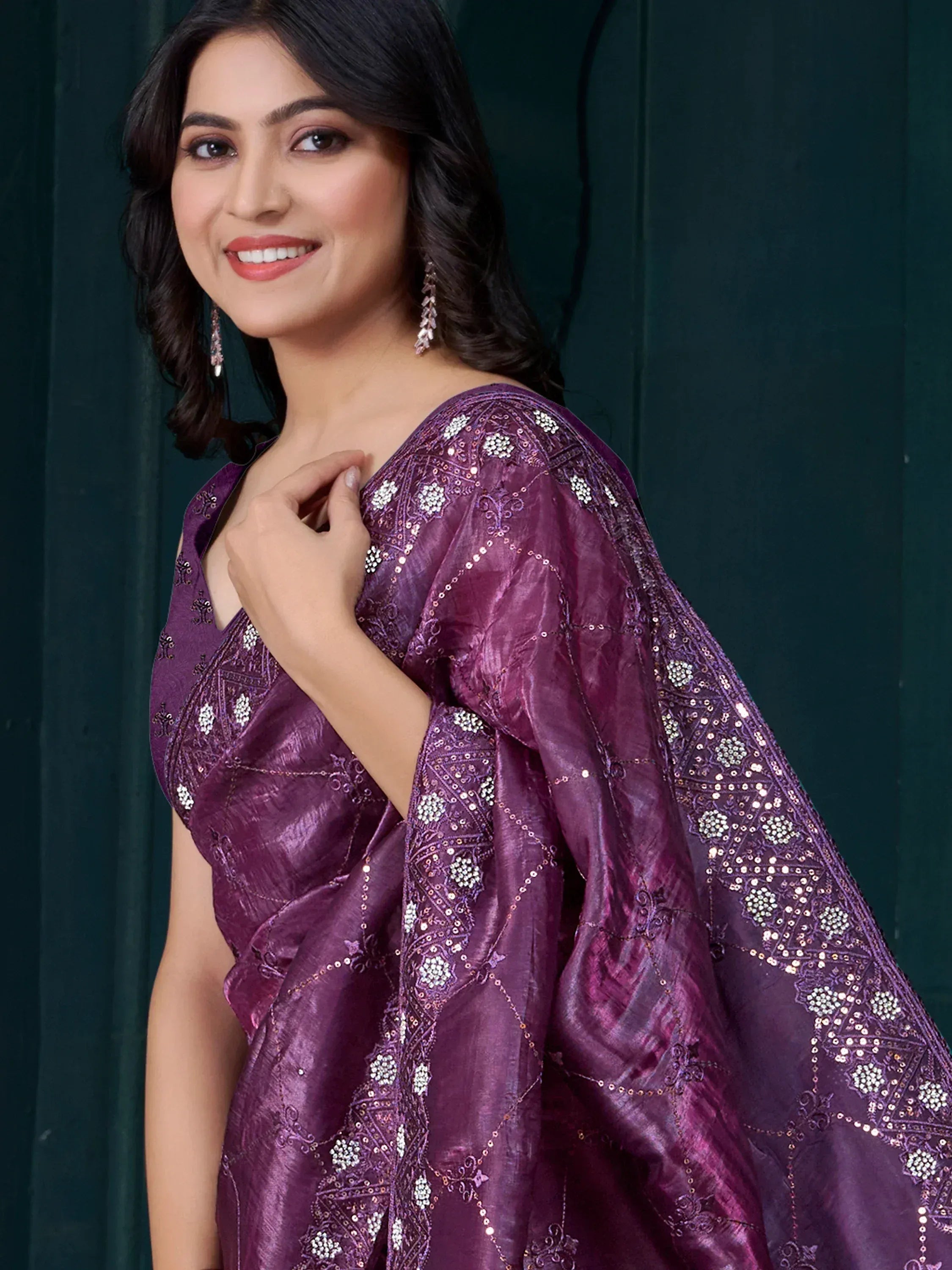 Elegant purple embroidered saree with floral motifs and sequins, perfect for Indian ethnic wear