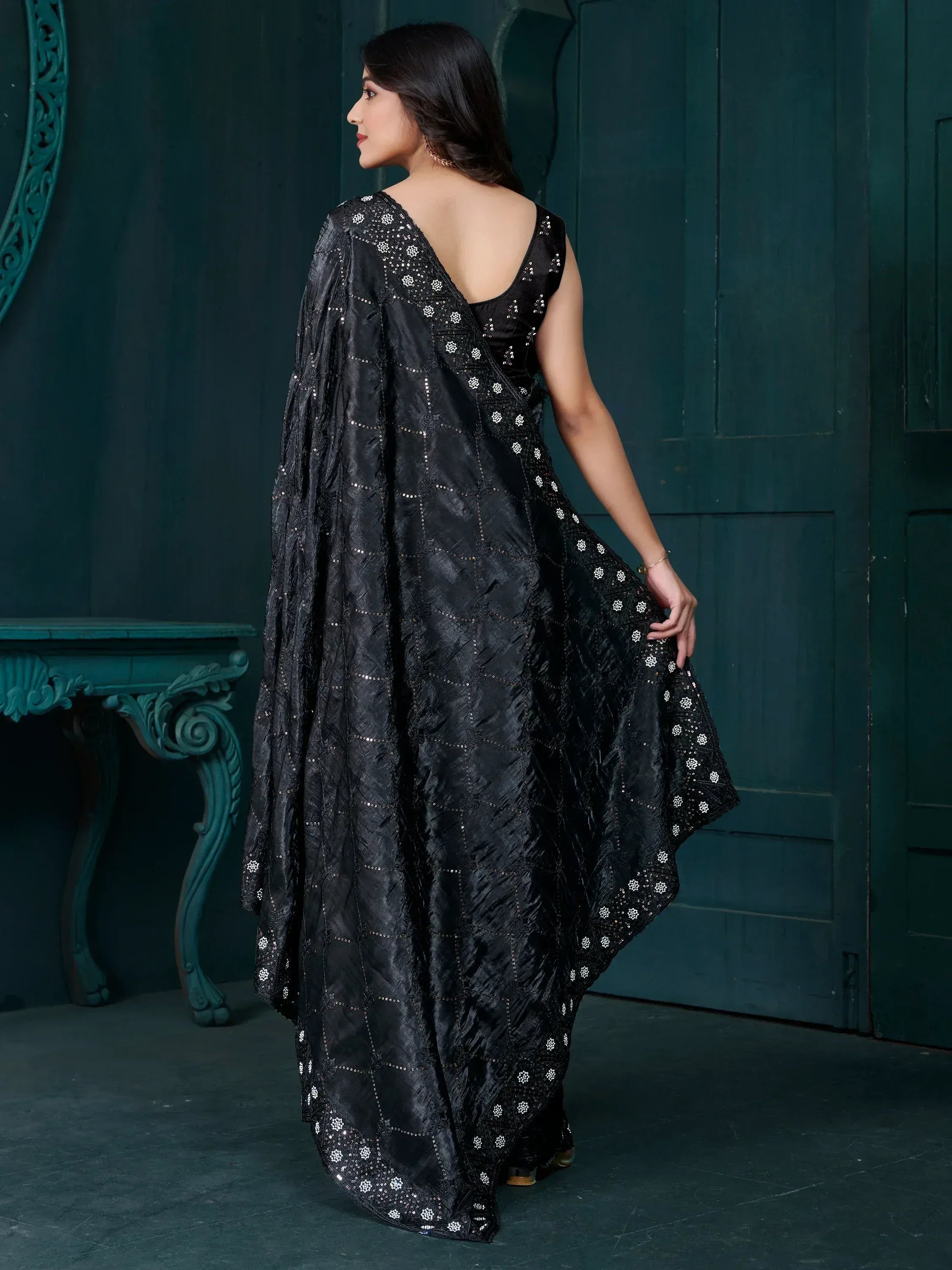 Black embroidered saree with sequin detailing, elegant ethnic wear for special occasions