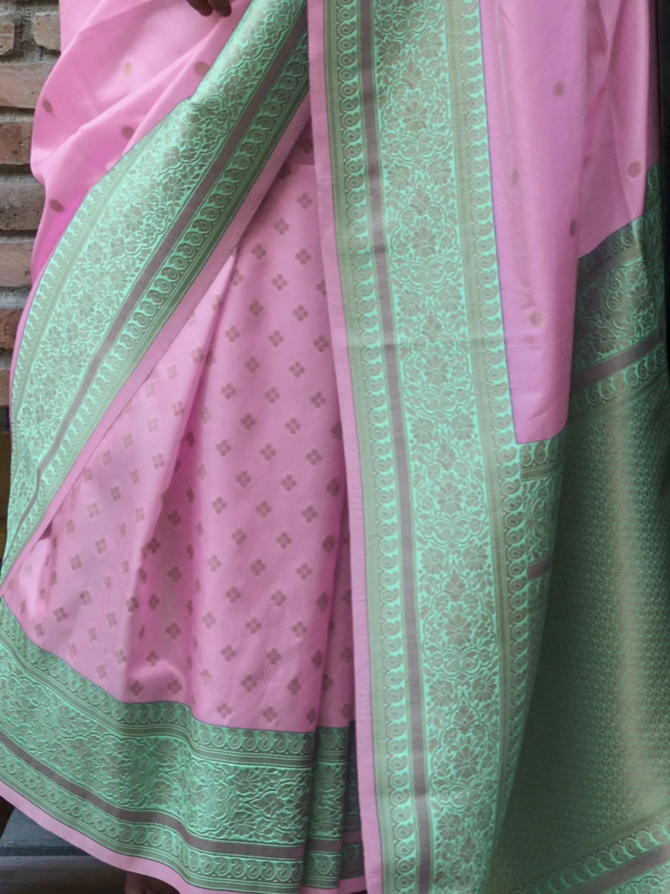 Pink saree with mint green border and floral motifs, traditional Indian ethnic wear