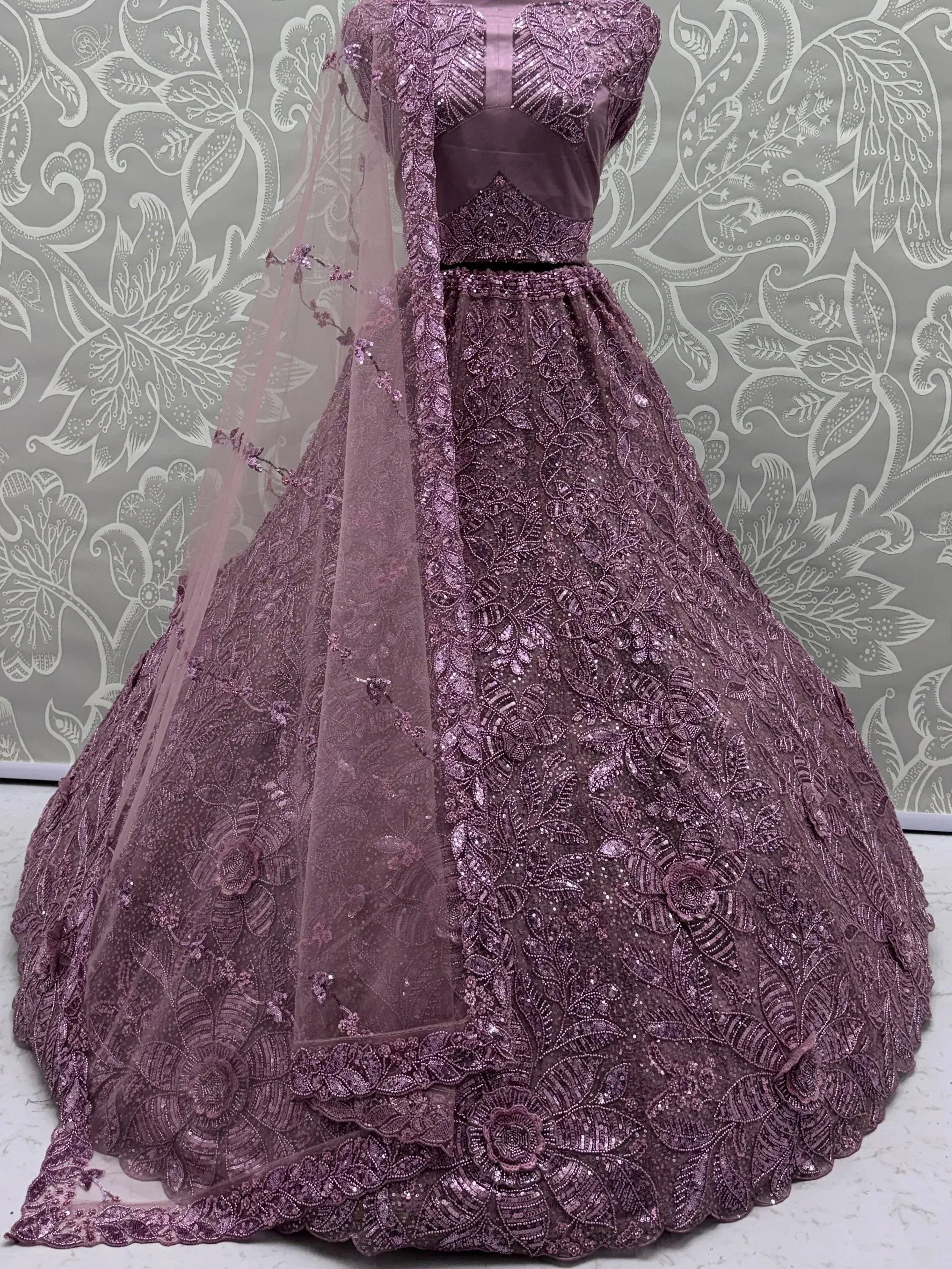 Impressive Purple Sequins Net Reception Wear Lehenga Choli