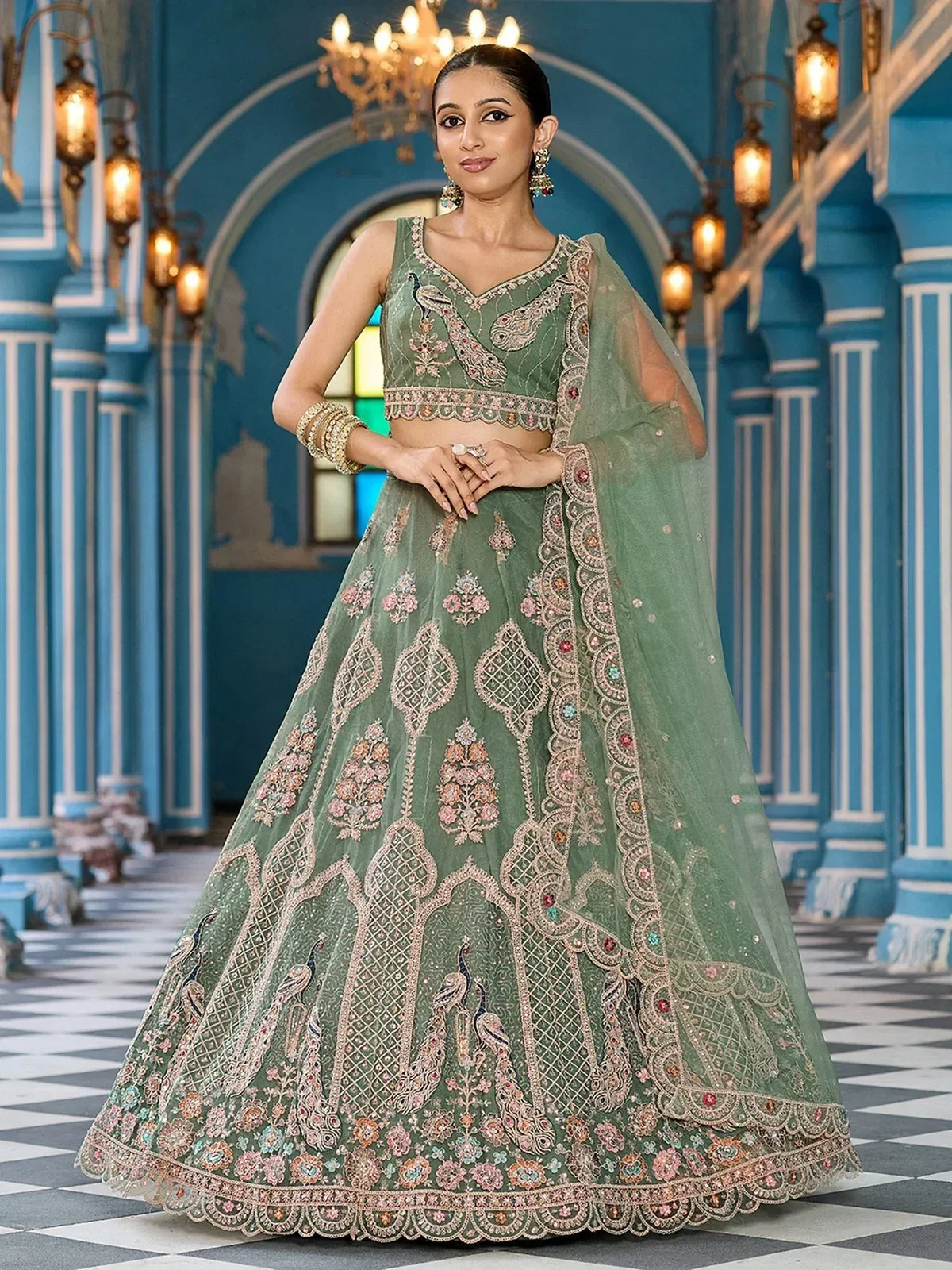 Elegant green lehenga choli with peacock embroidery, perfect for Indian weddings and festive occasions.