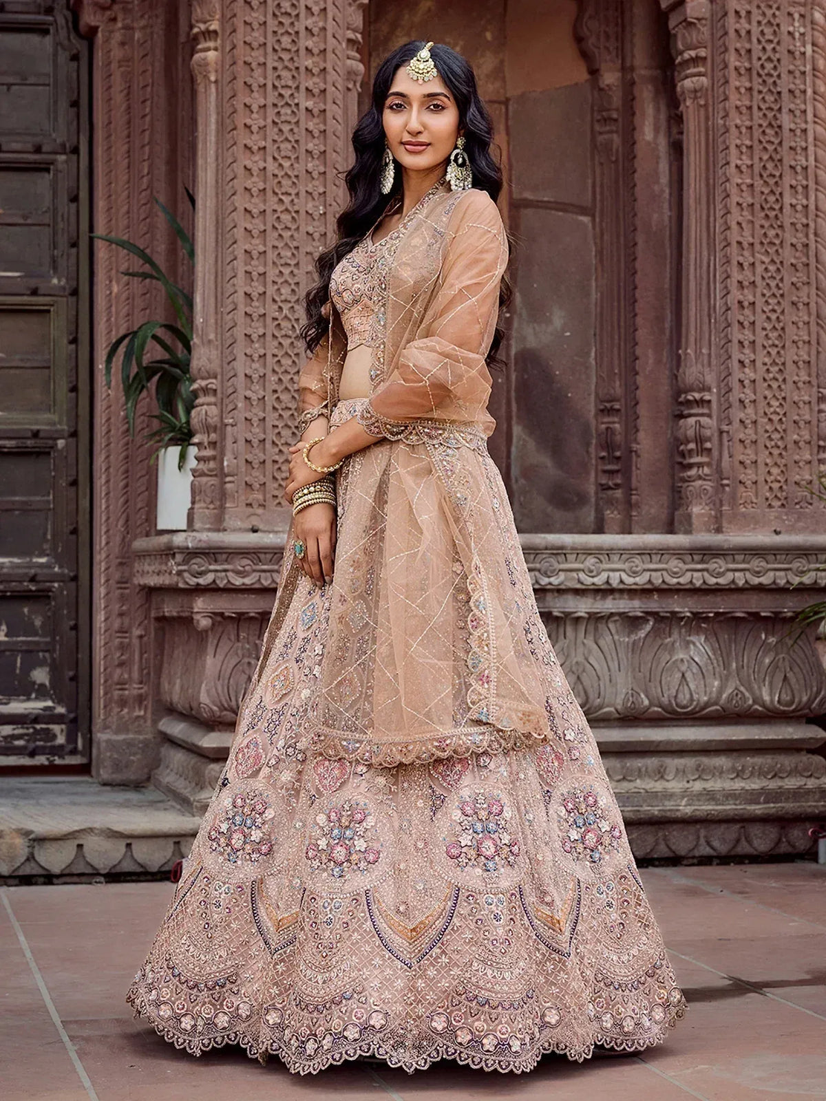 Elegant beige embroidered lehenga choli with floral motifs, perfect for Indian ethnic wear