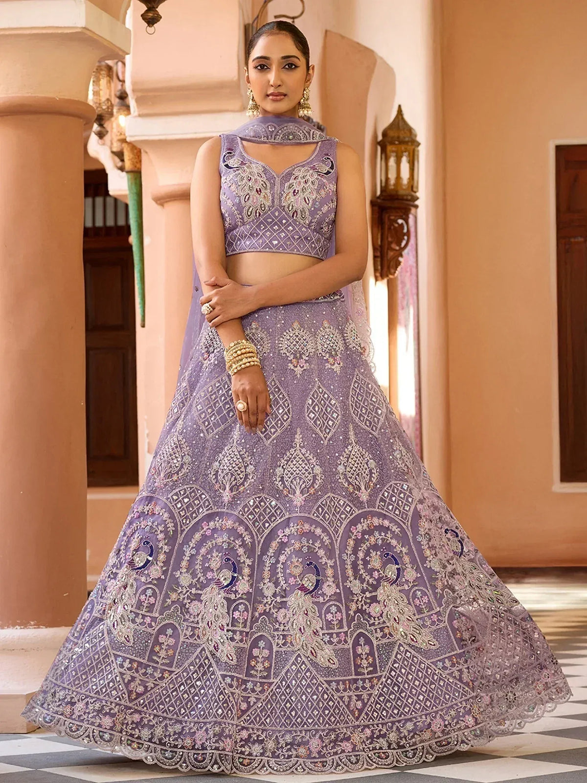 Elegant lavender lehenga choli with peacock embroidery and intricate beadwork for Indian ethnic wear