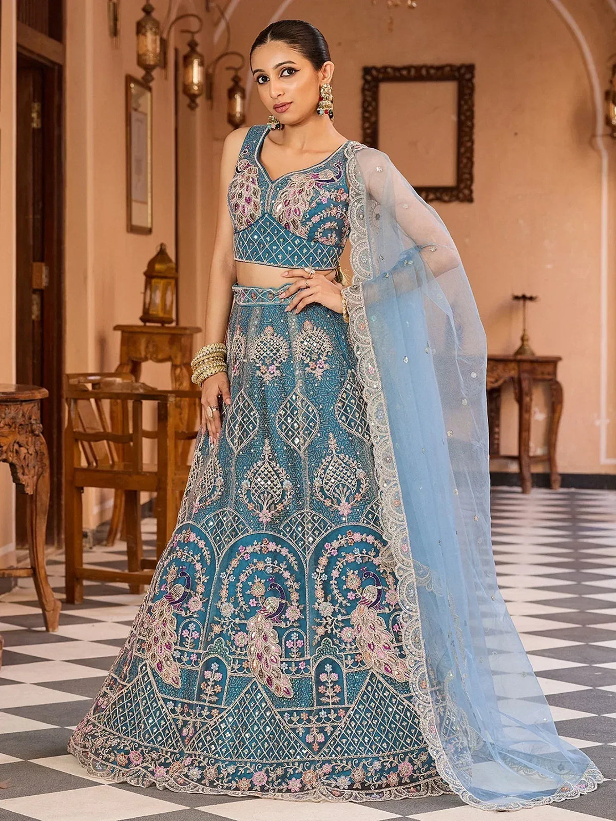 Elegant blue lehenga choli with peacock embroidery and sheer dupatta for Indian ethnic wear