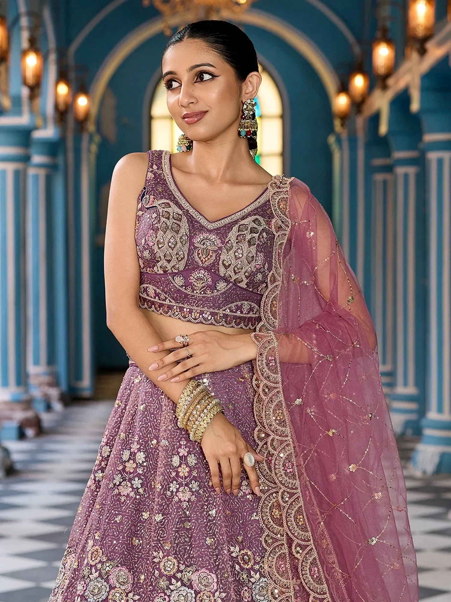 Pretty Lavender Embroidered Net Reception Wear Lehenga Choli