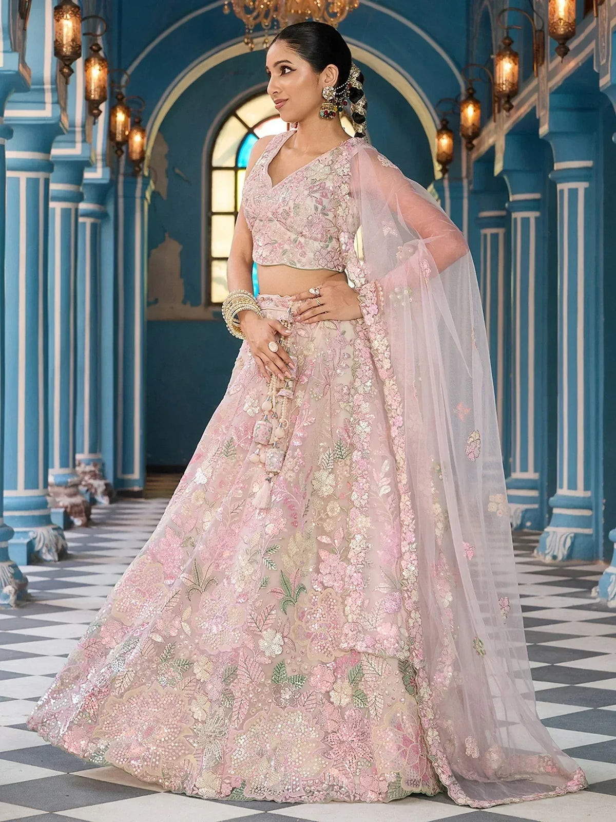 Pink floral embroidered lehenga choli with sheer dupatta, perfect for Indian weddings and festive occasions