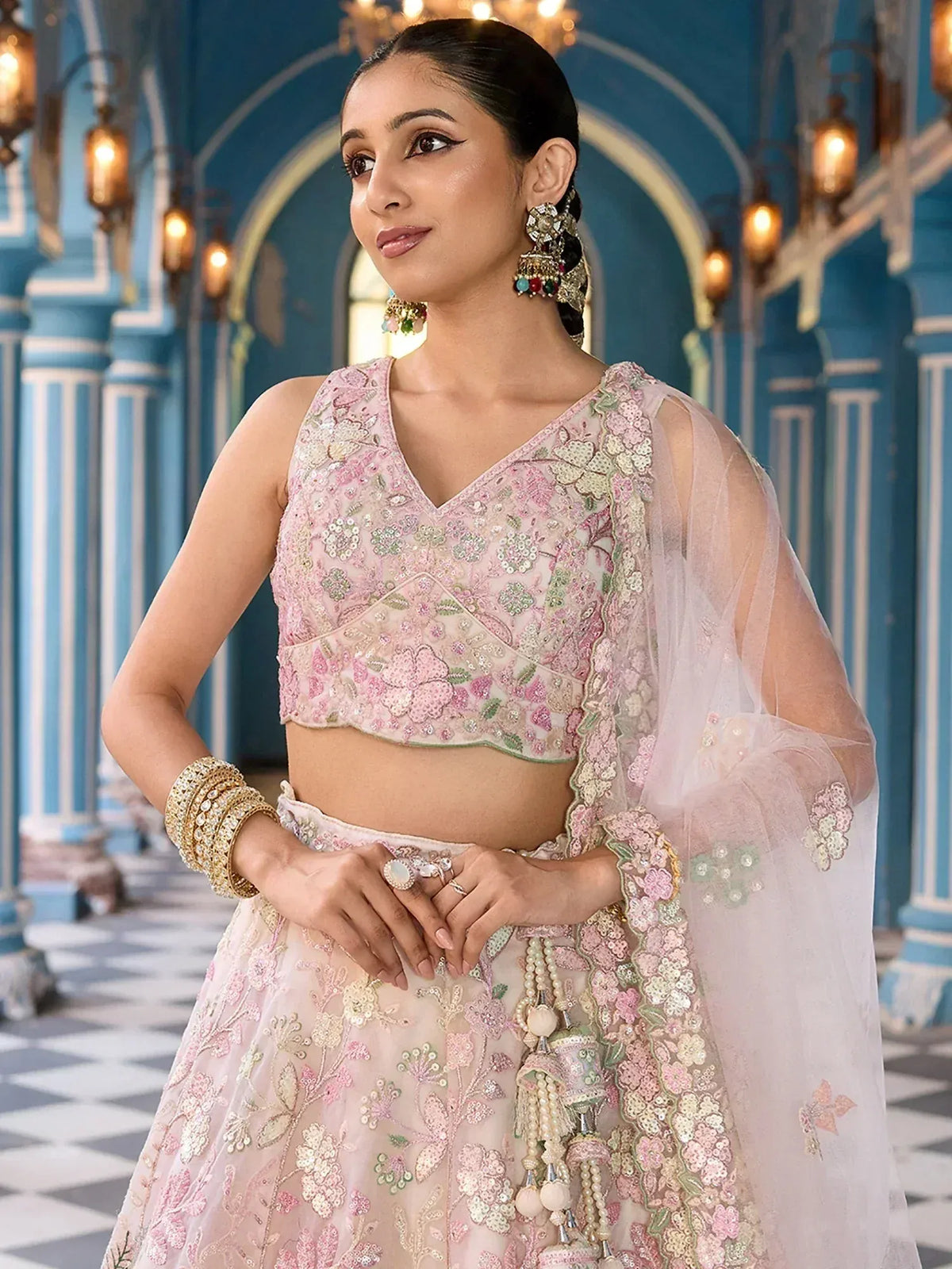 Pink floral embroidered lehenga choli with sheer dupatta, perfect for Indian weddings and festive occasions
