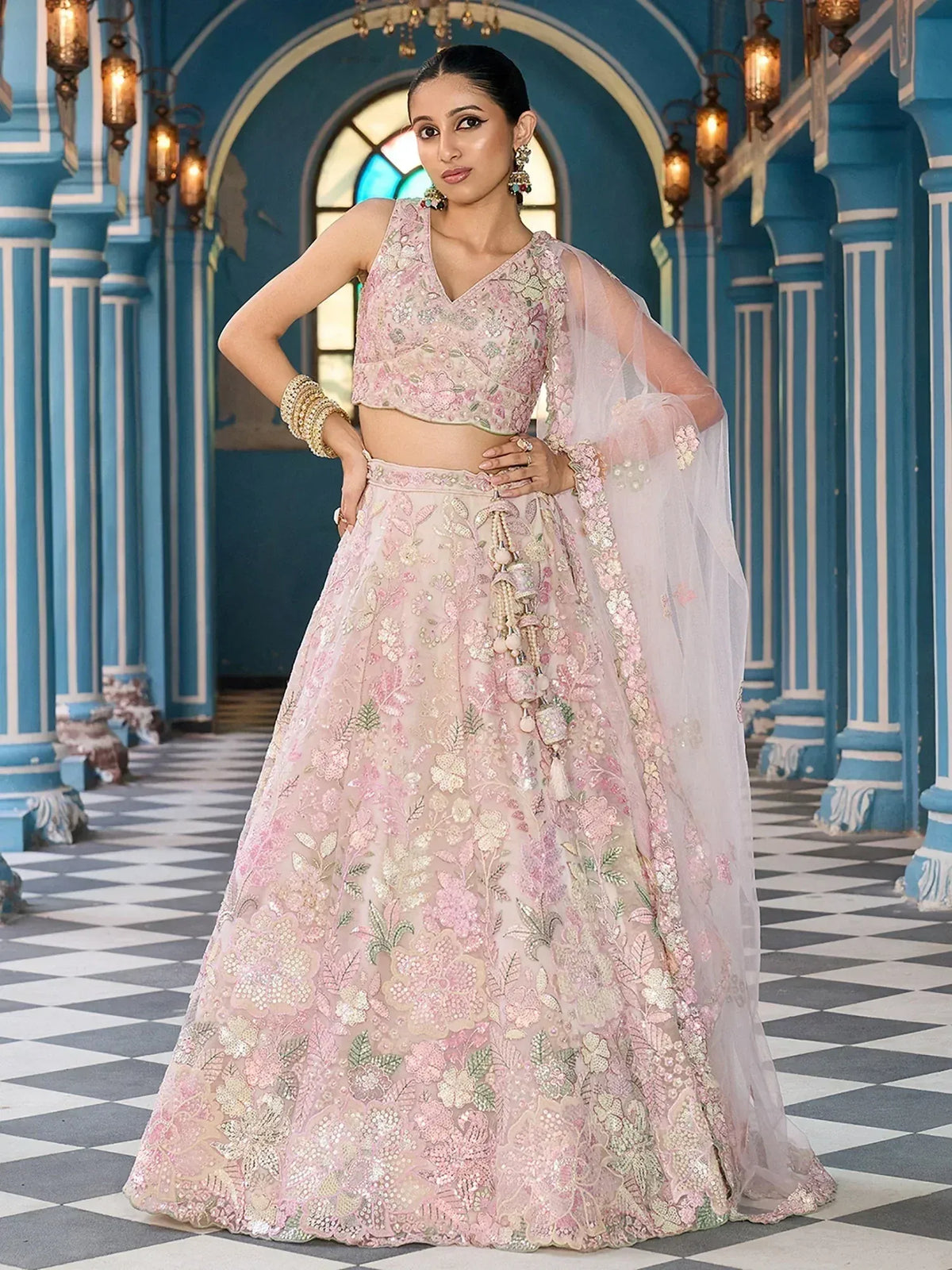 Pink floral embroidered lehenga choli with sheer dupatta, perfect for Indian weddings and festive occasions.