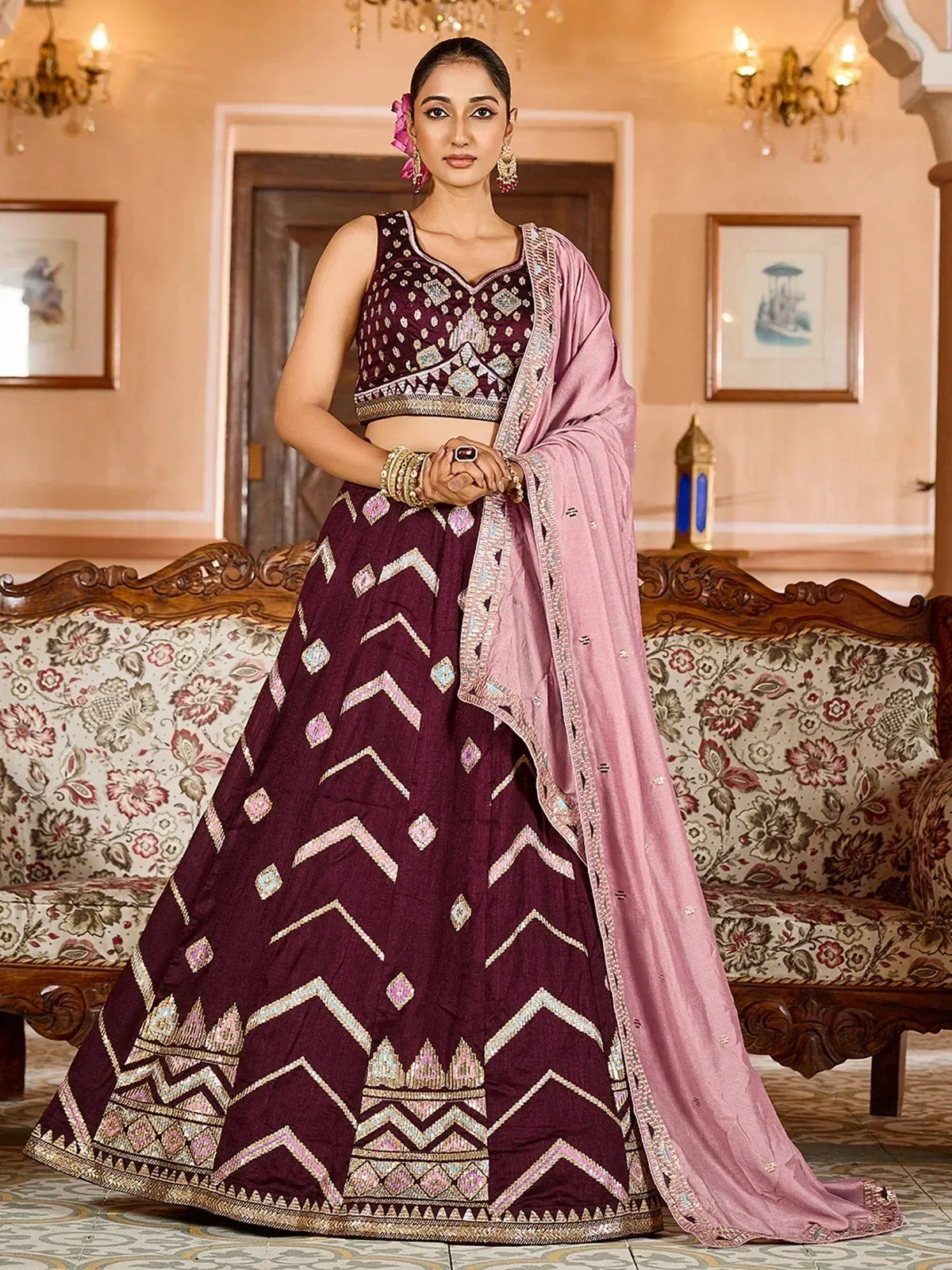Elegant maroon lehenga choli with geometric embroidery and pink dupatta for Indian ethnic wear