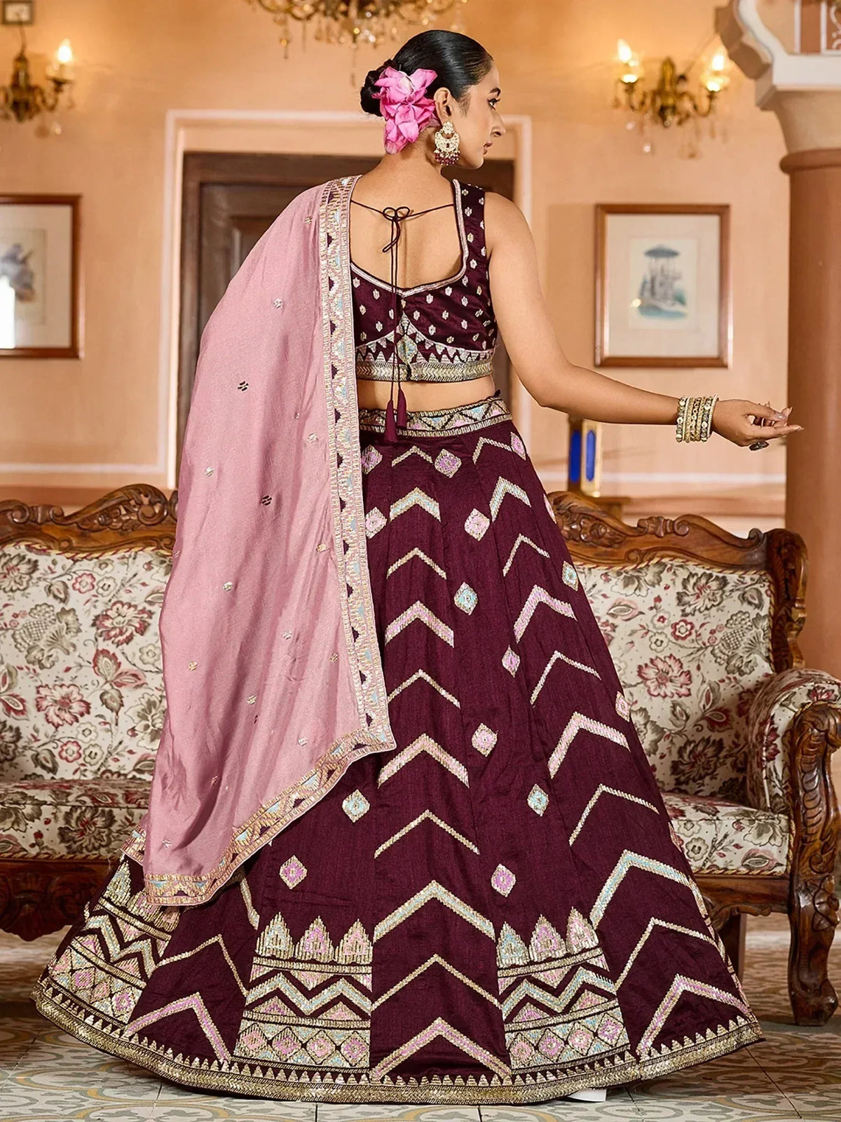 Maroon lehenga choli with geometric embroidery and pink dupatta for ethnic wear