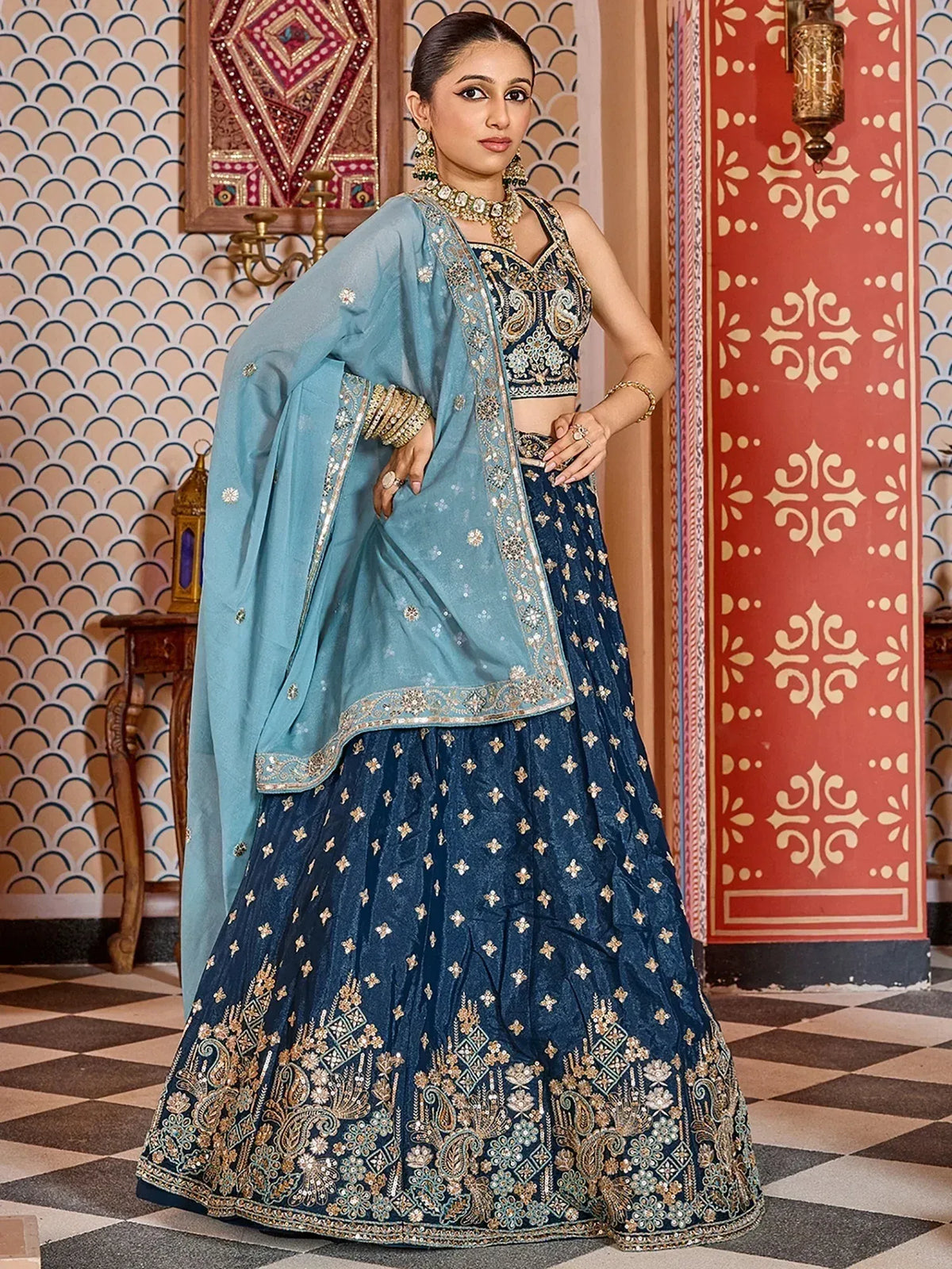 Elegant navy blue lehenga choli with gold embroidery and light blue dupatta for Indian ethnic wear