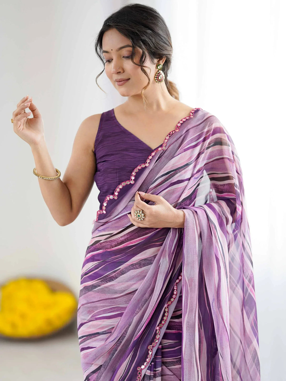 Purple striped saree with mirror work, paired with sleeveless blouse, perfect for Indian ethnic occasions