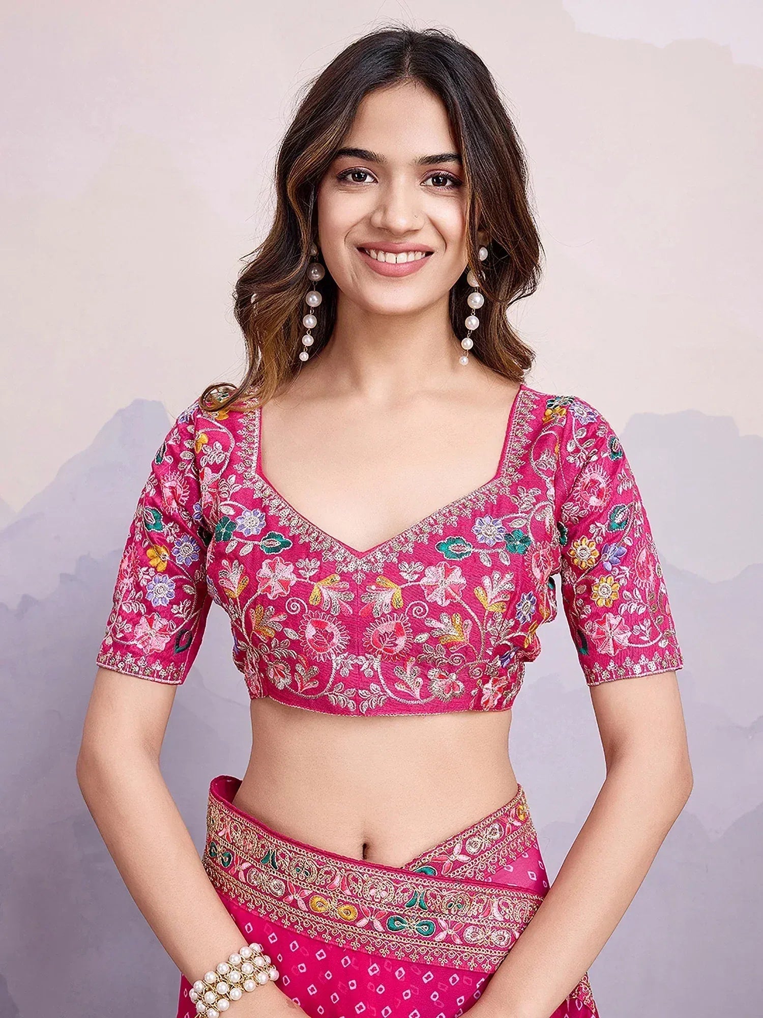 Pink embroidered lehenga choli with floral motifs, perfect for Indian ethnic wear occasions
