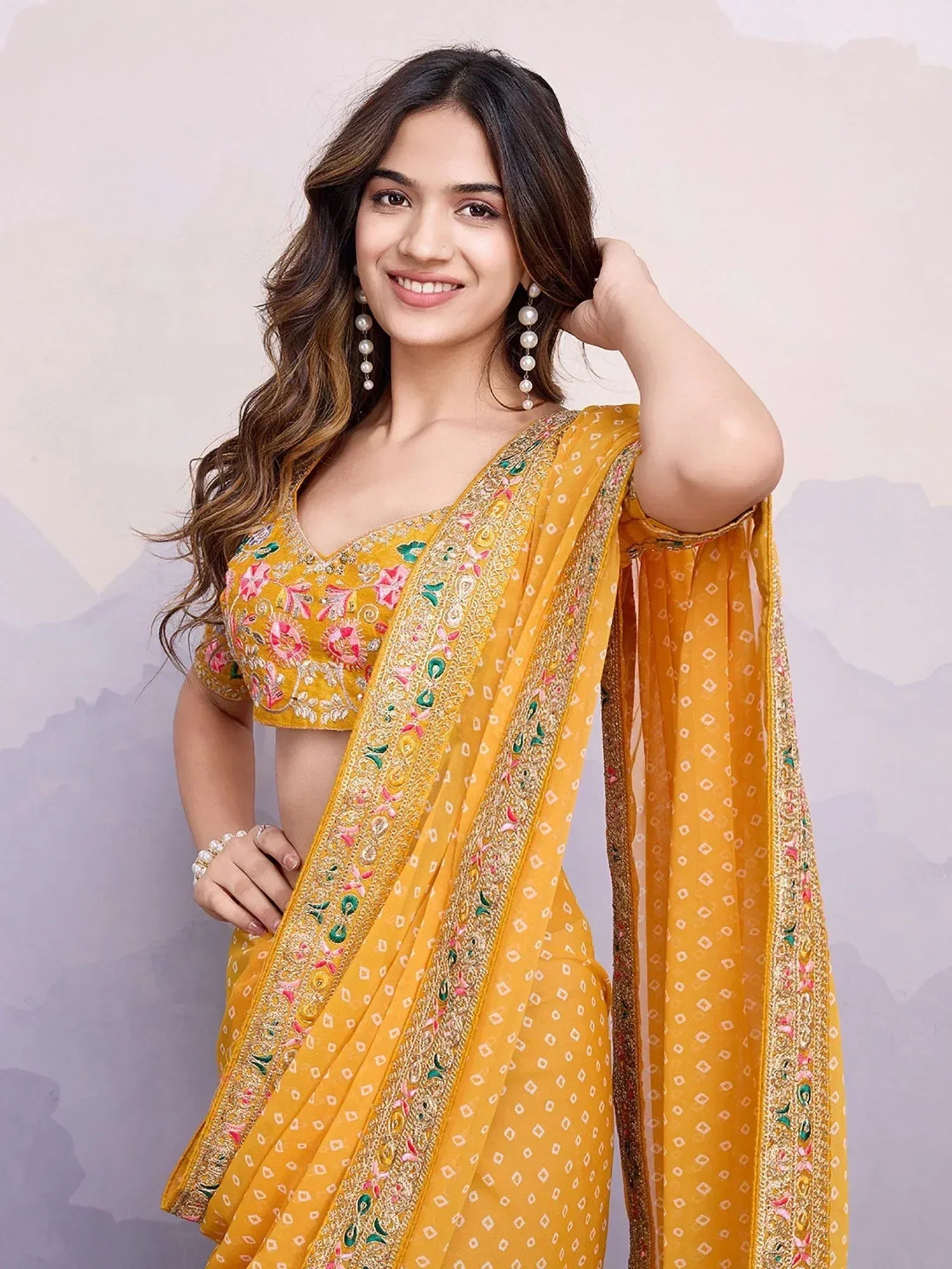 Yellow embroidered saree with floral blouse, perfect for Indian ethnic wear occasions