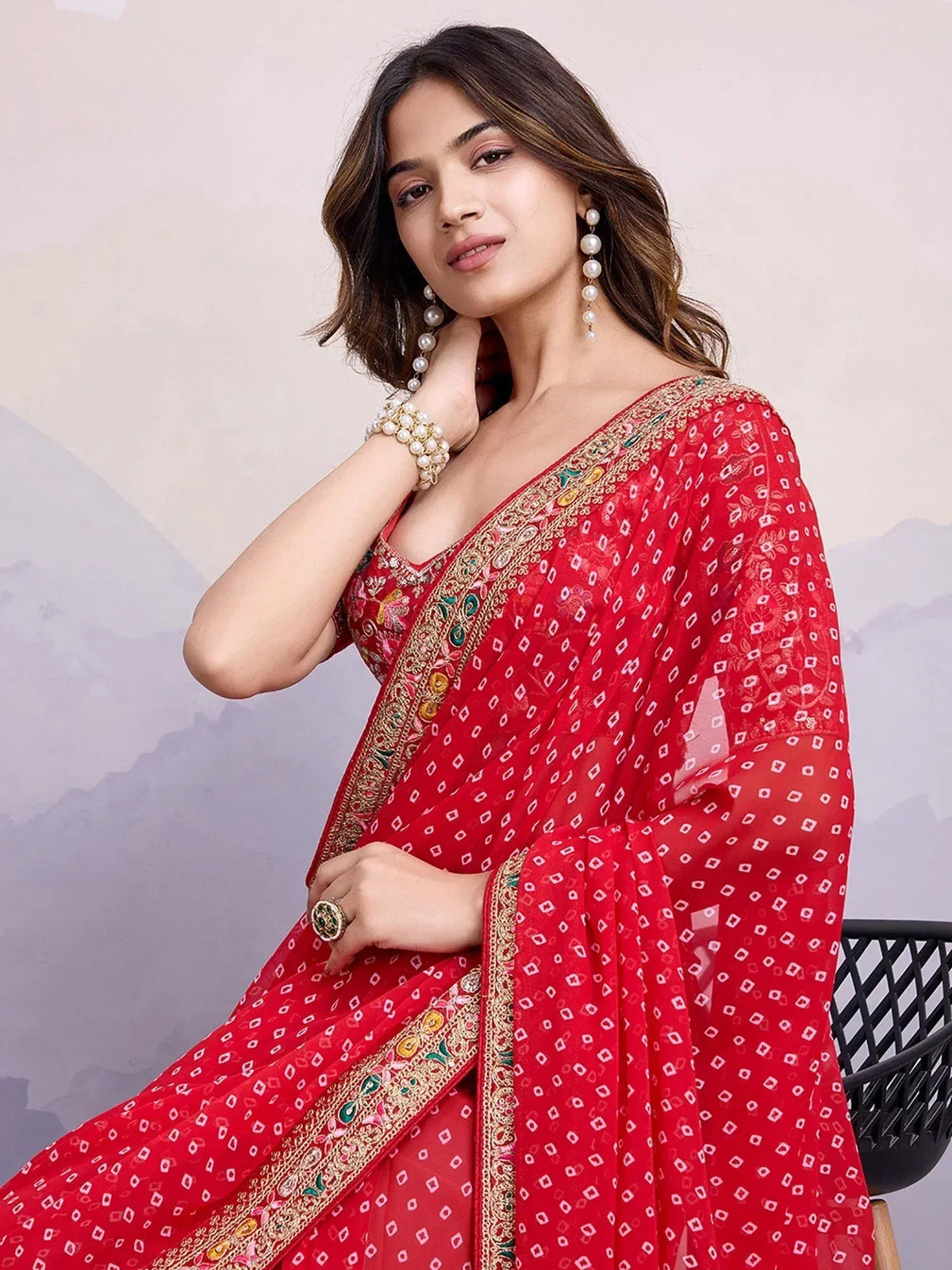 Red printed saree with embroidered border, perfect for Indian ethnic wear and festive occasions