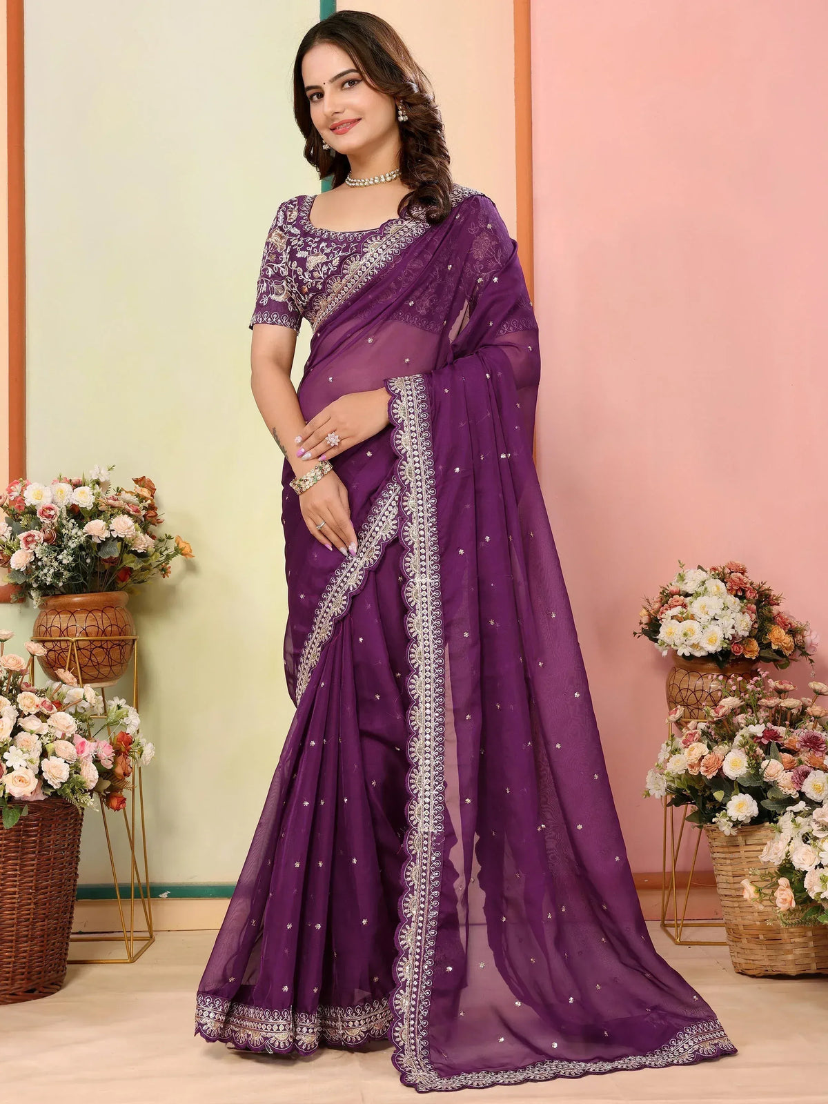 Purple embroidered saree with intricate white detailing, perfect for ethnic occasions