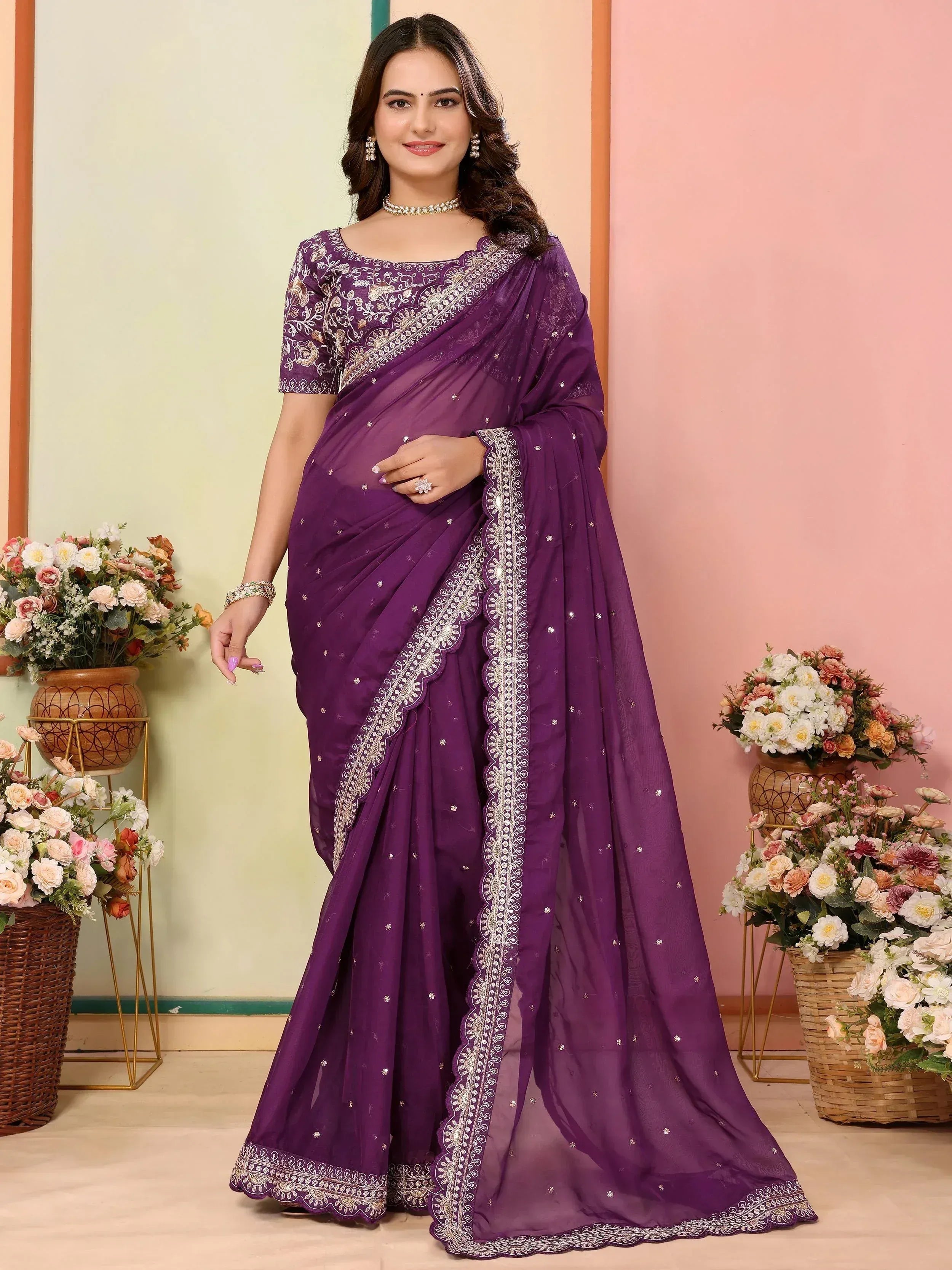 Purple designer saree with intricate embroidery, perfect for ethnic wear occasions.
