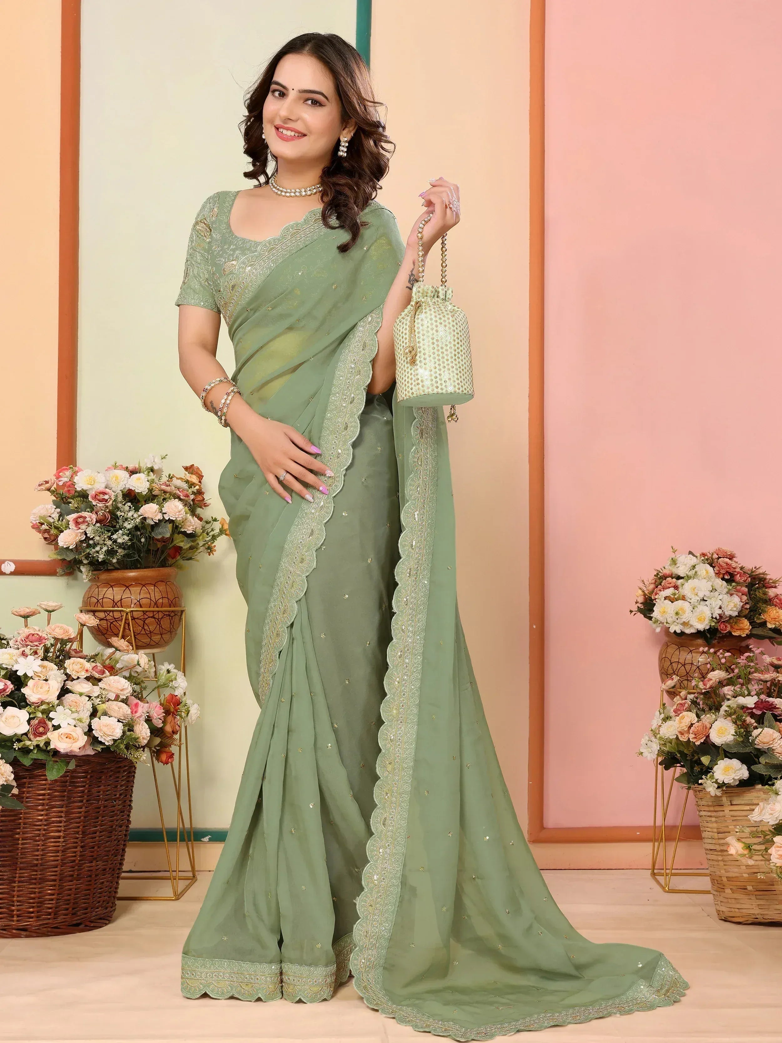 Mint green embroidered saree with scalloped border, perfect for Indian ethnic wear occasions