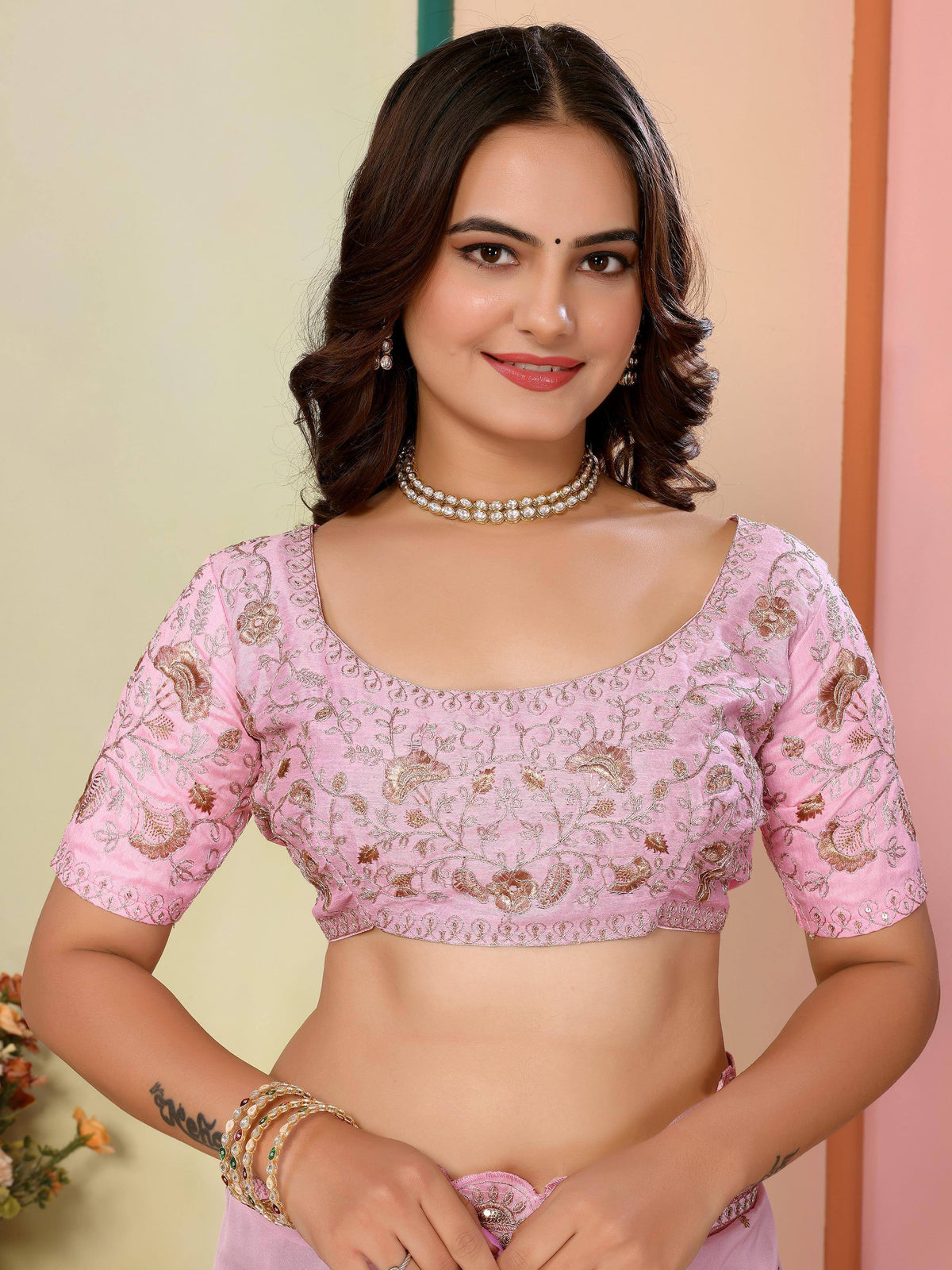 Pink embroidered blouse with gold floral design, perfect for Indian ethnic wear and saree styling