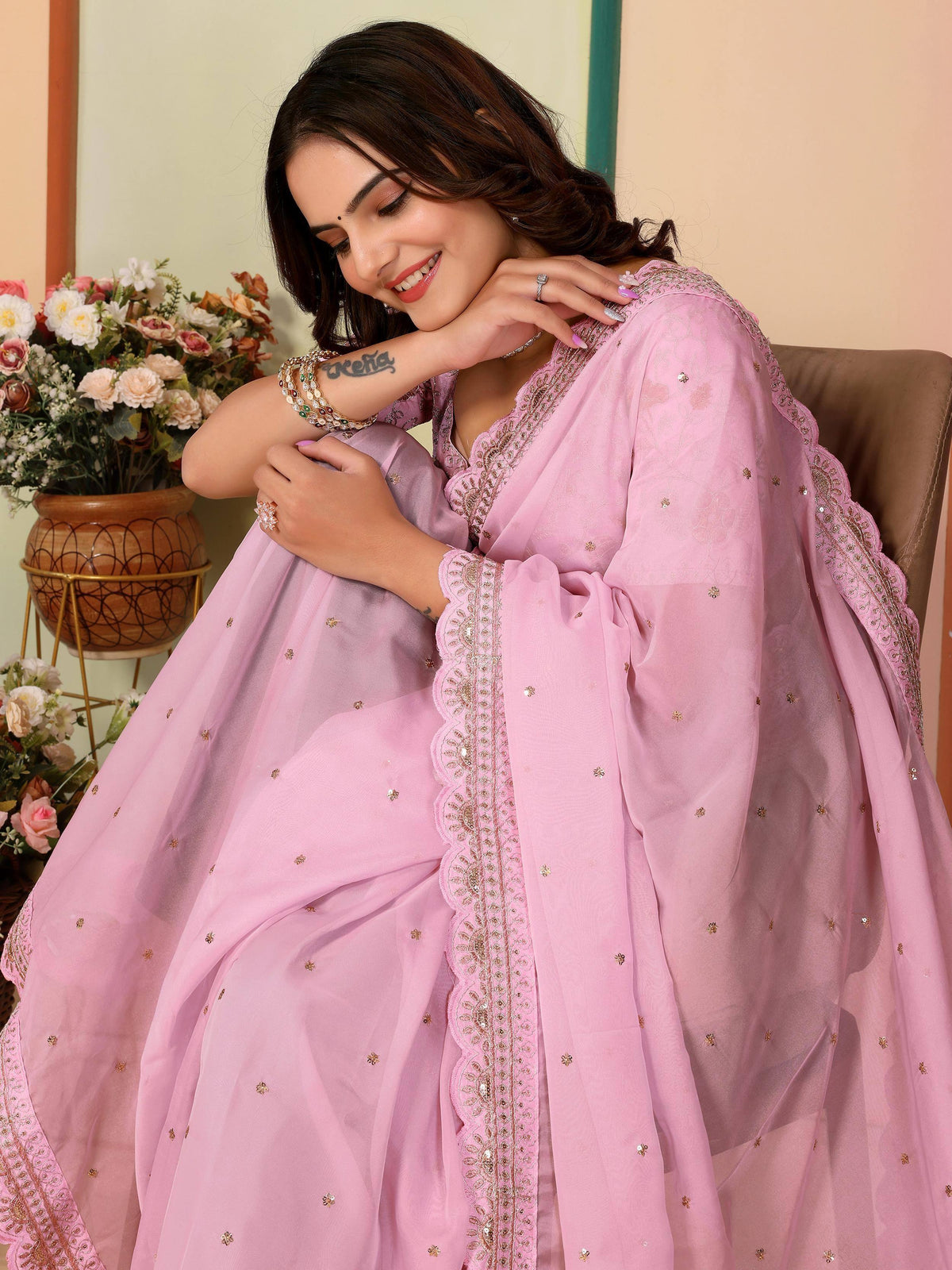 Pink embroidered ethnic gown with scalloped detailing, perfect for Indian occasions and festive wear.