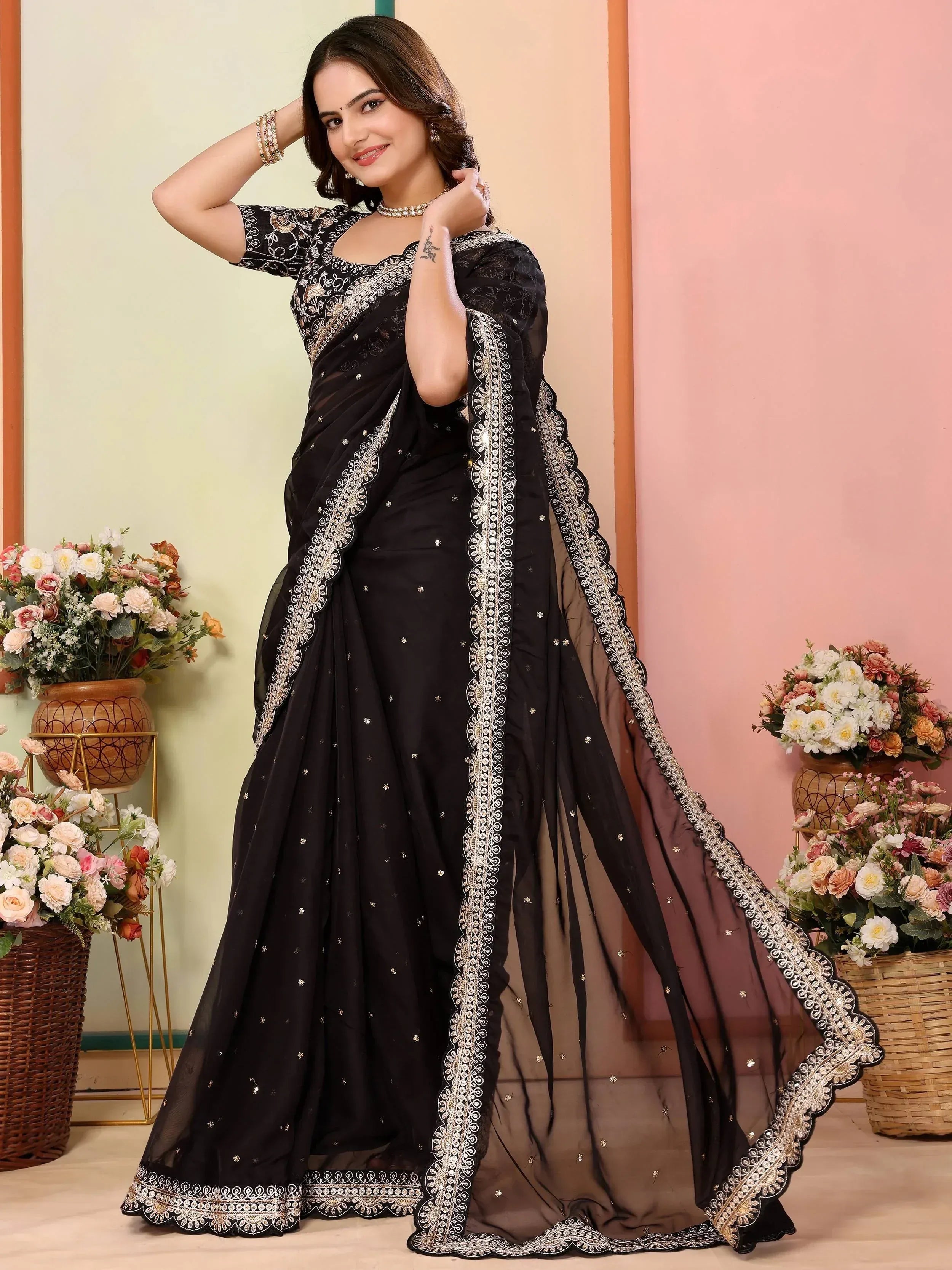 Black embroidered saree with gold detailing, perfect for Indian ethnic wear occasions
