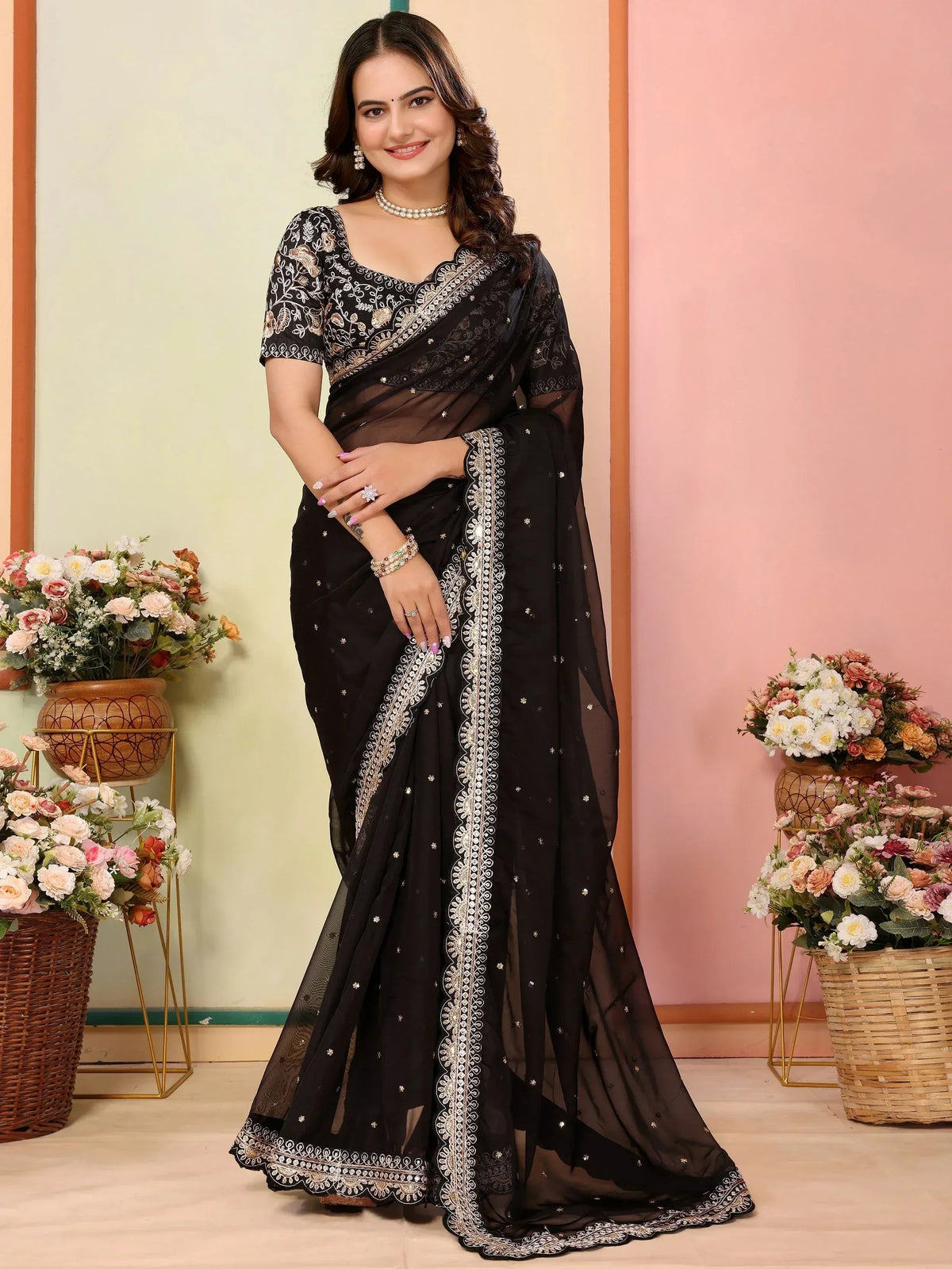Black embroidered saree with gold detailing, perfect for Indian ethnic wear and festive occasions.