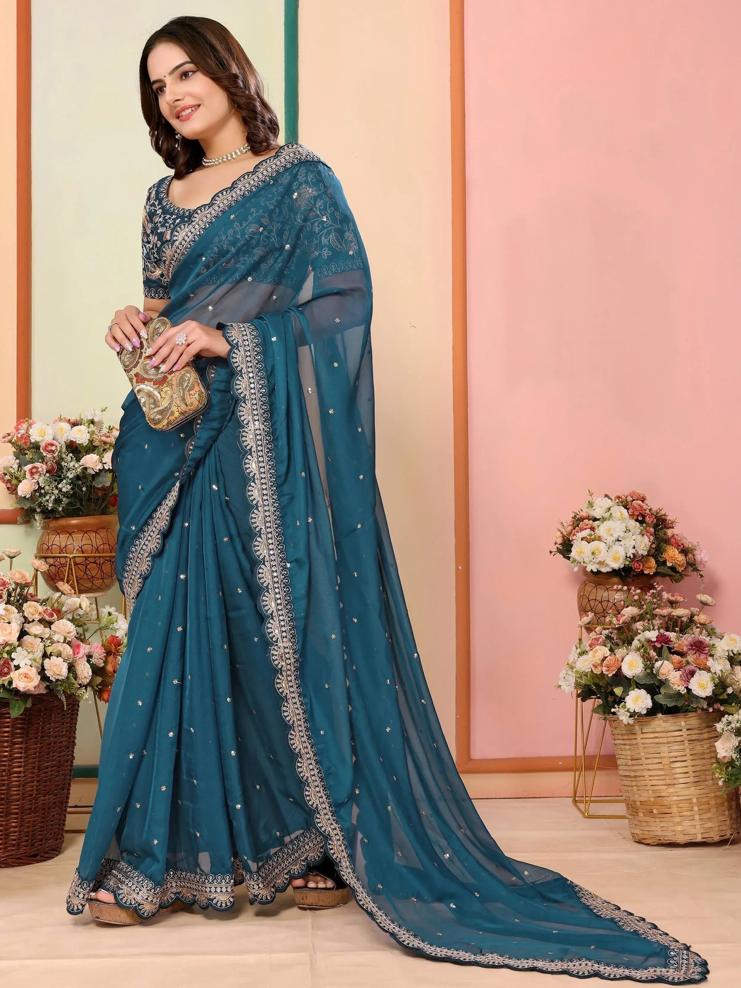 Teal blue embroidered saree with silver detailing, perfect for Indian ethnic wear occasions
