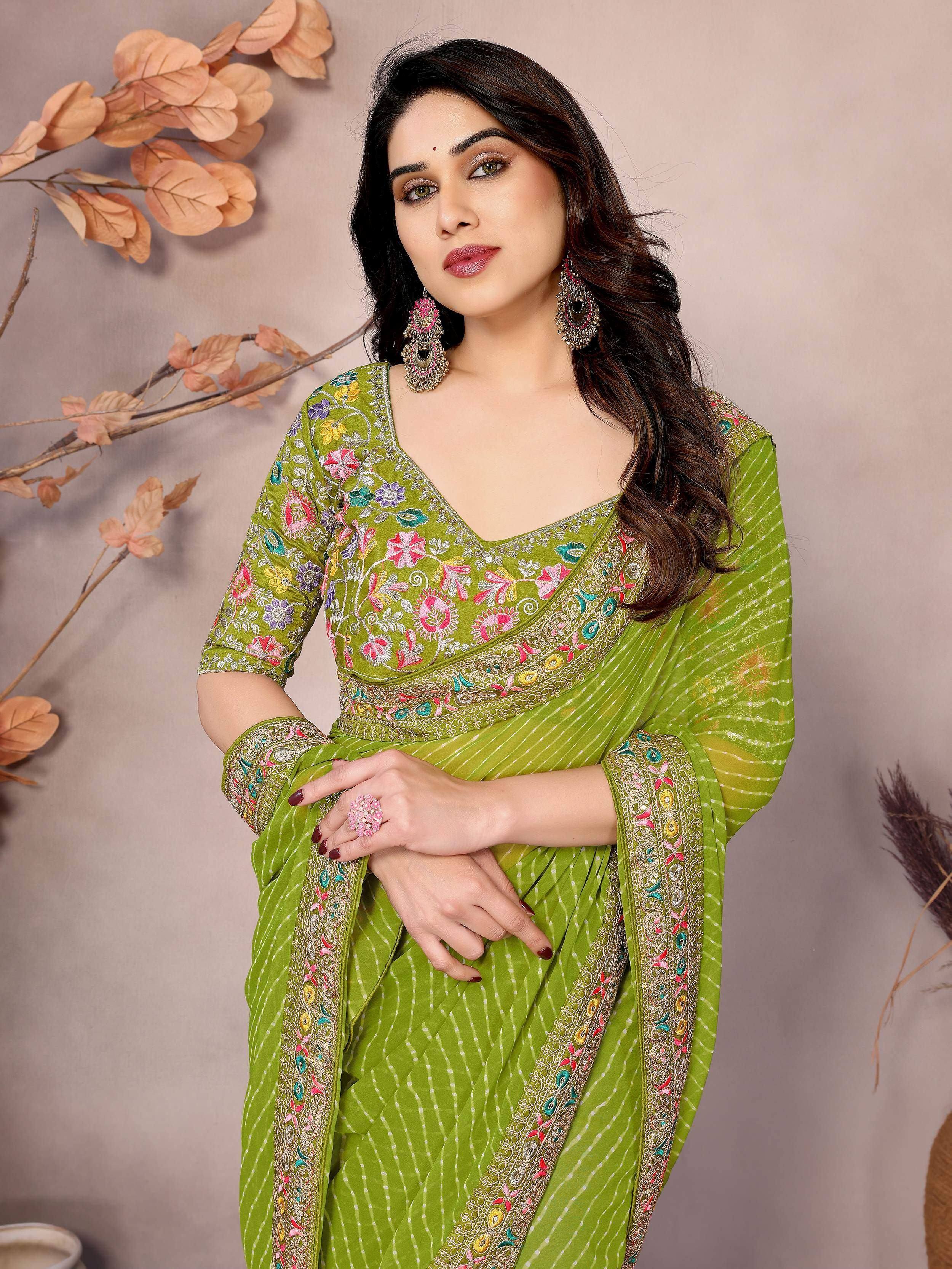 Green embroidered saree with floral motifs and matching blouse, ideal for Indian ethnic wear occasions.