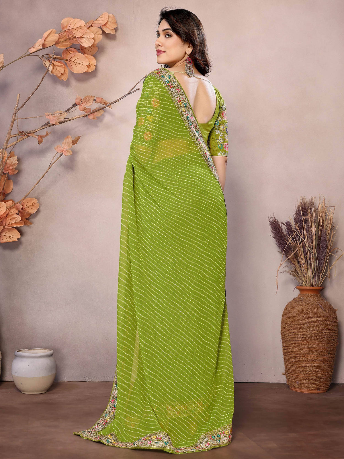 Green printed saree with embroidered border and backless blouse, Indian ethnic wear