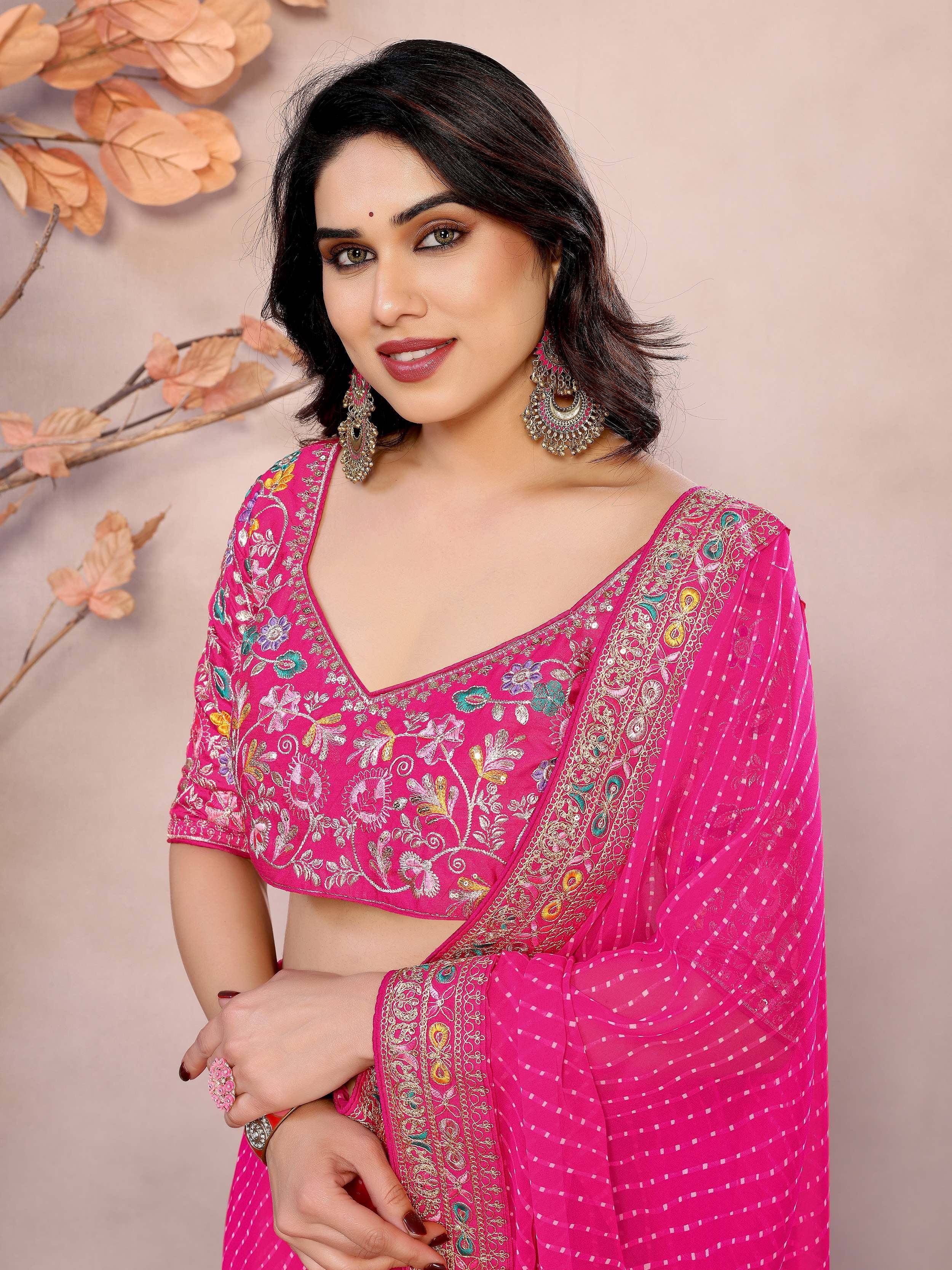 Pink embroidered lehenga choli with floral motifs and sheer dupatta, perfect for Indian ethnic wear