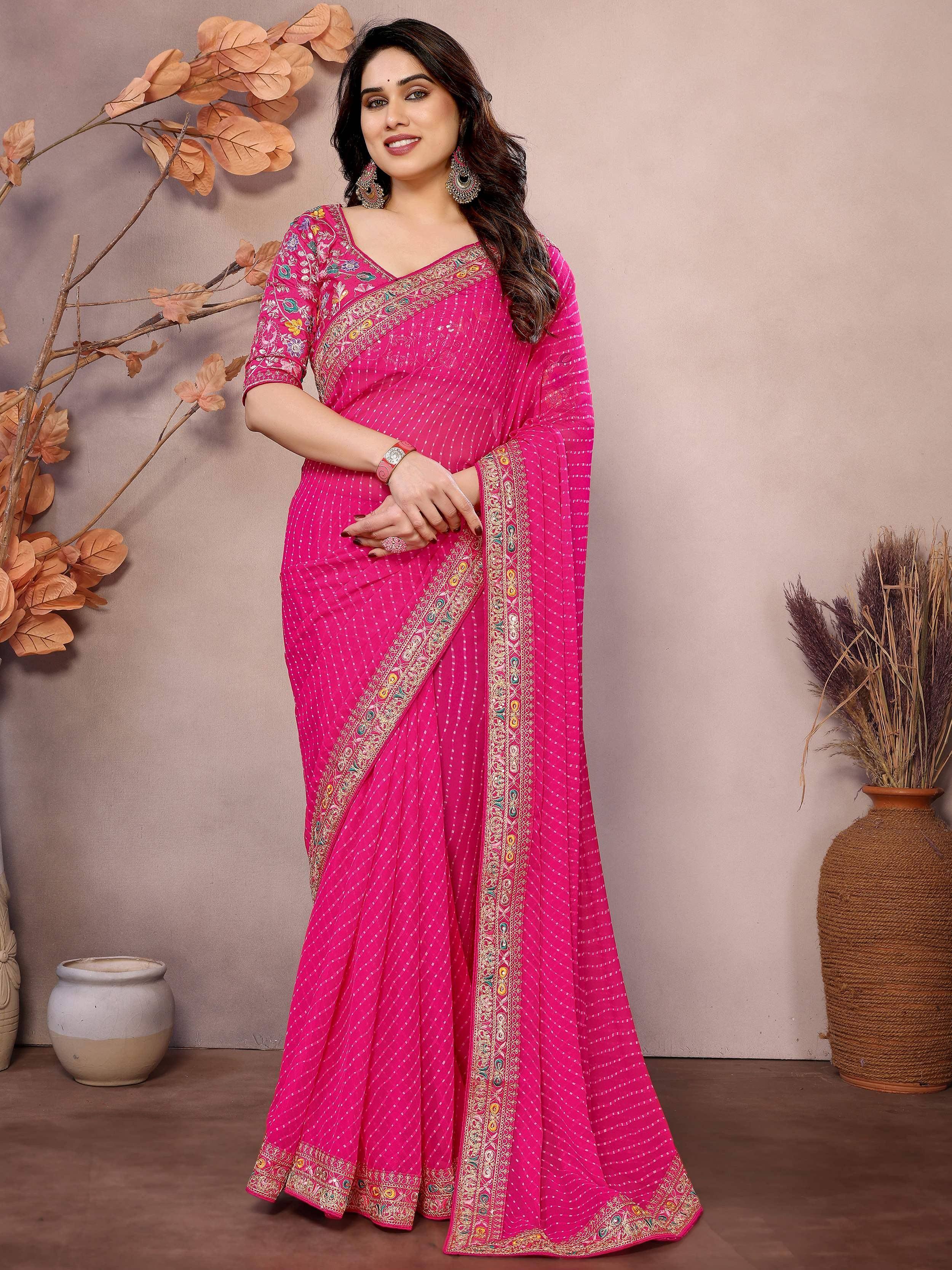 Vibrant pink embroidered saree with floral blouse, perfect for Indian ethnic occasions