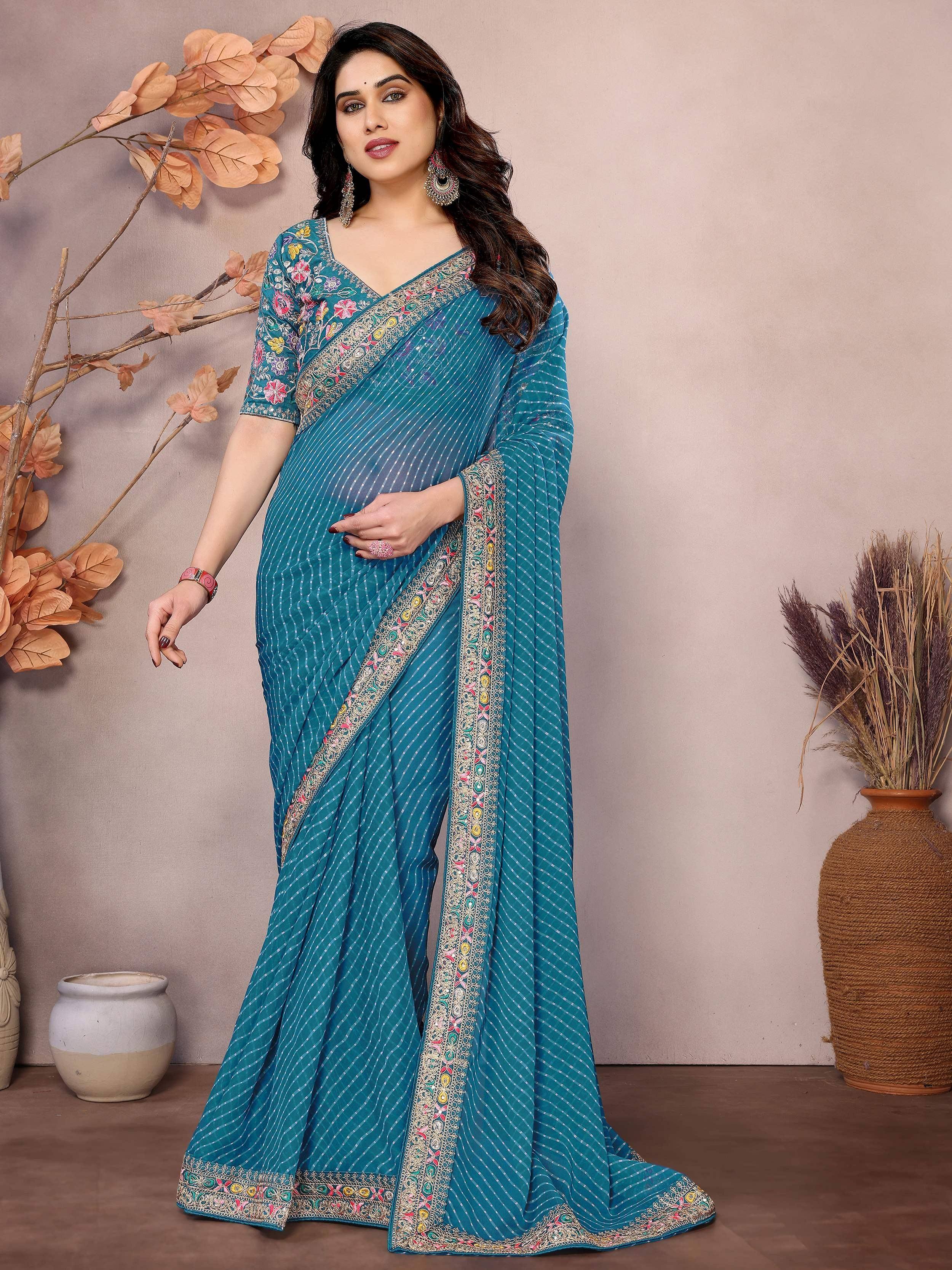 Teal embroidered saree with floral blouse, perfect for Indian ethnic wear occasions