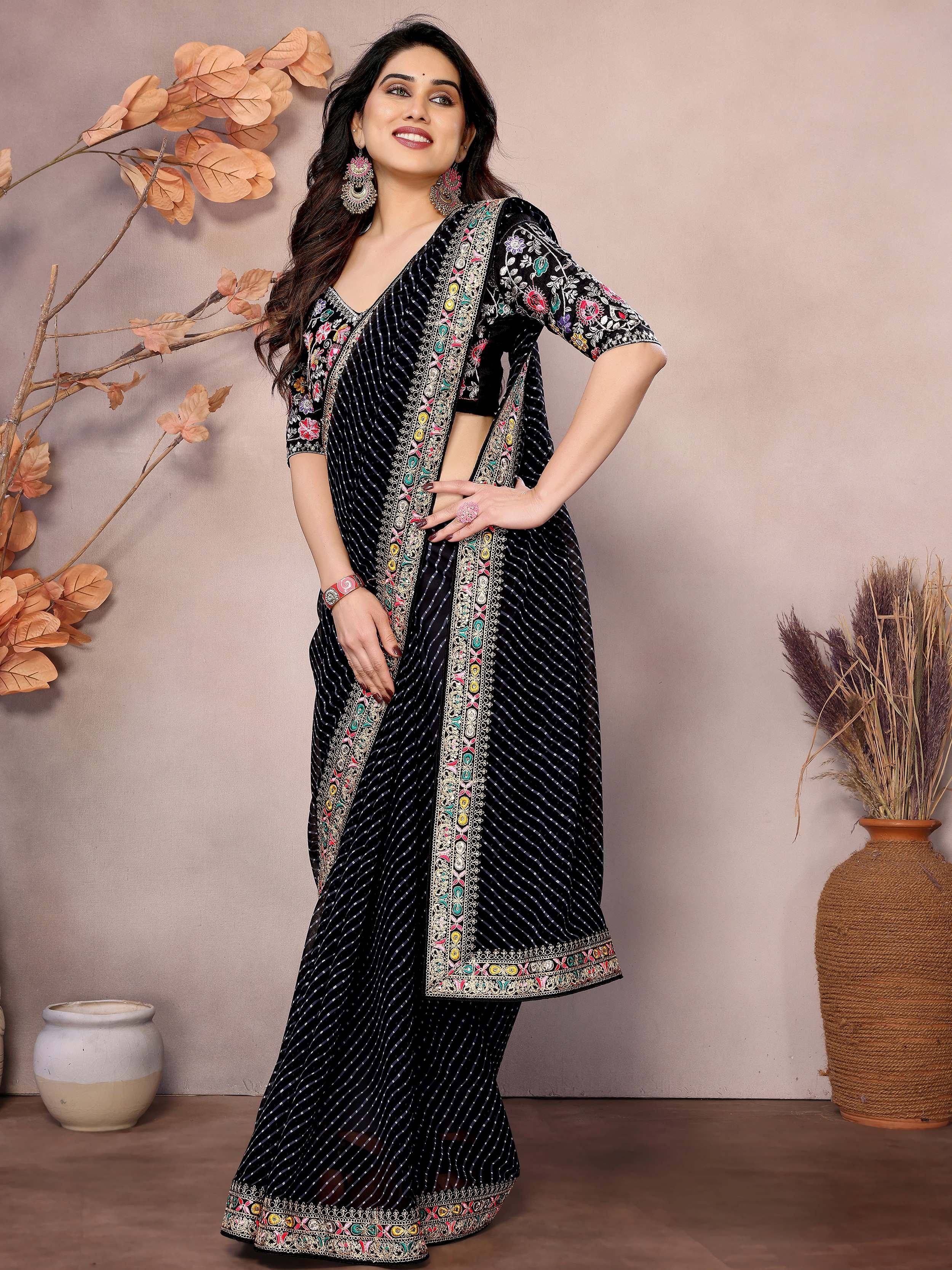 Black embroidered ethnic salwar kameez with floral detailing, perfect for Indian wear occasions.