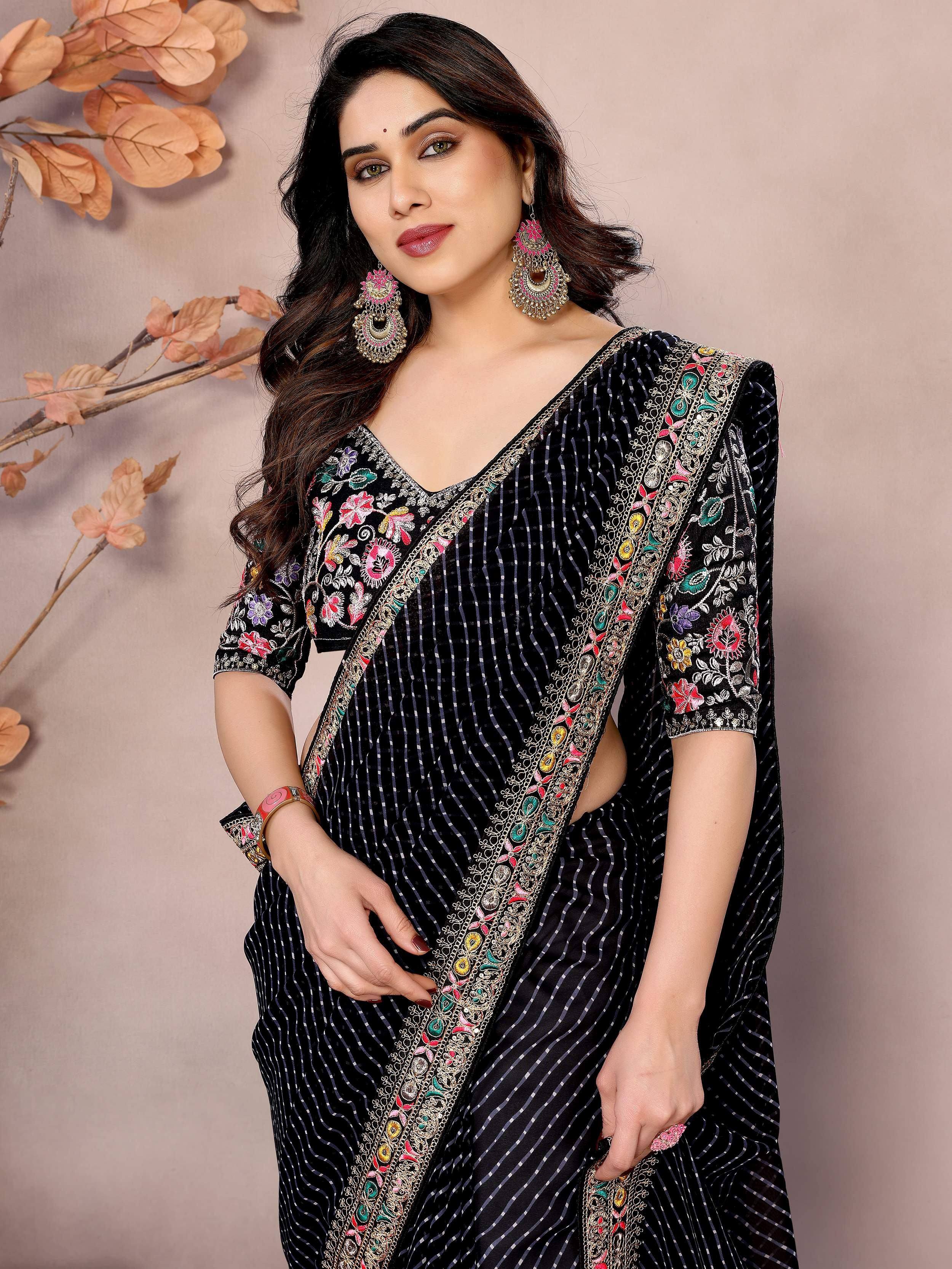 Black embroidered saree with floral border, perfect for Indian ethnic wear occasions