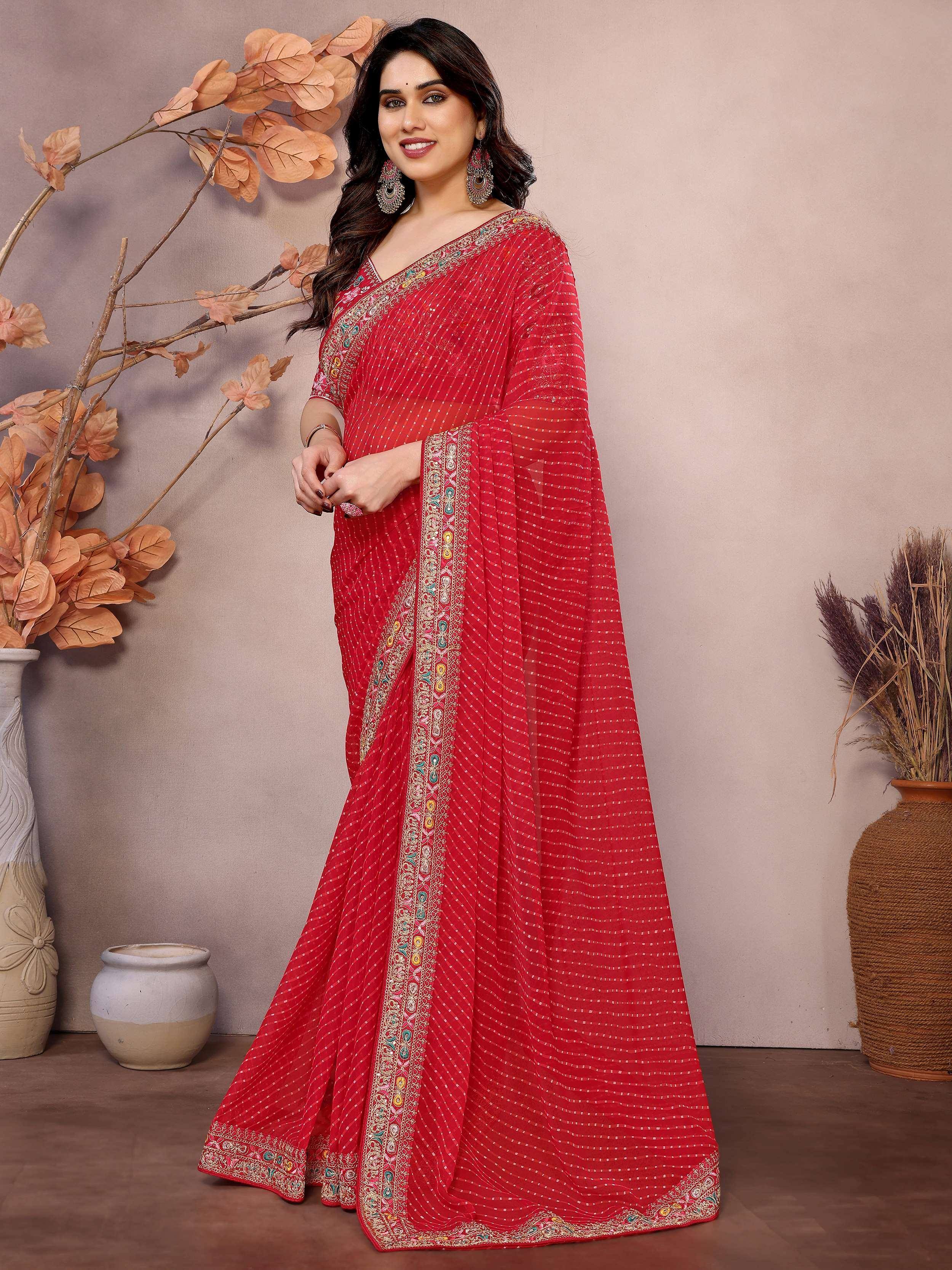 Red embroidered saree with intricate border design, perfect for ethnic occasions