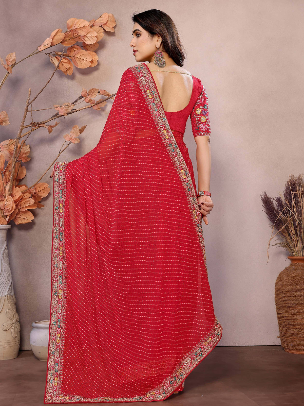 Red embroidered saree with floral border, back view, Indian ethnic wear