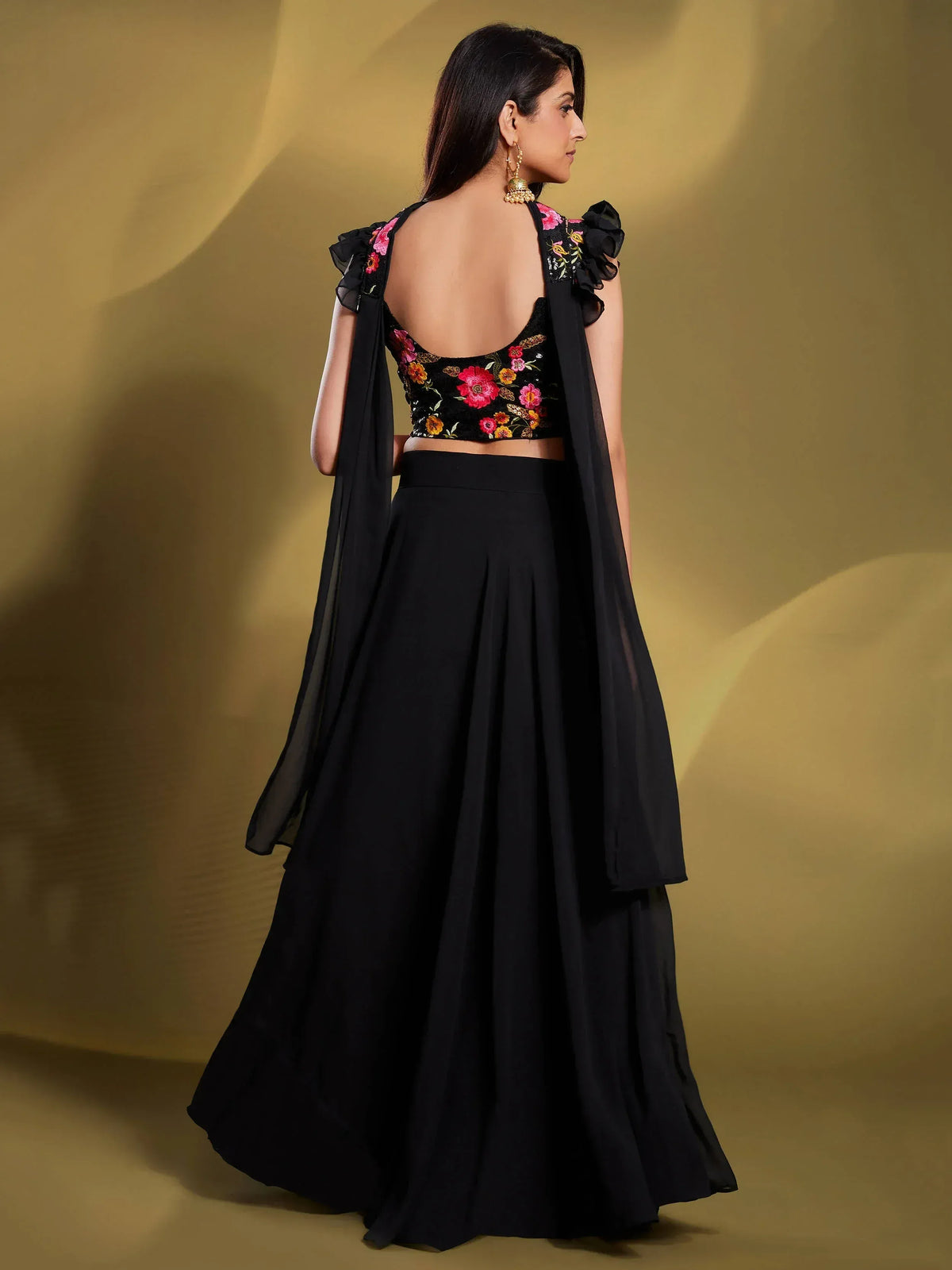 Black floral embroidered lehenga choli with ruffled sleeves and sheer dupatta
