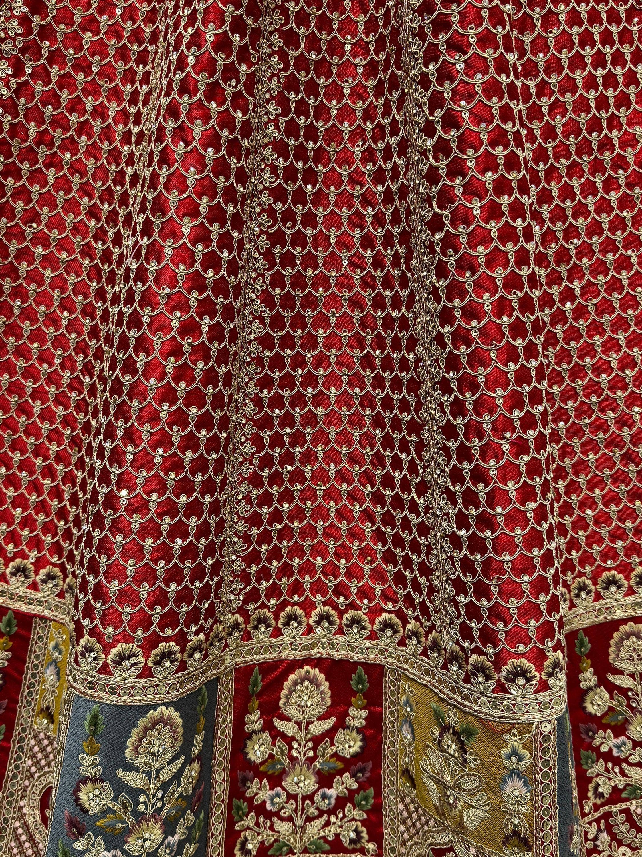 Red ethnic lehenga with gold scalloped embroidery and floral patchwork details