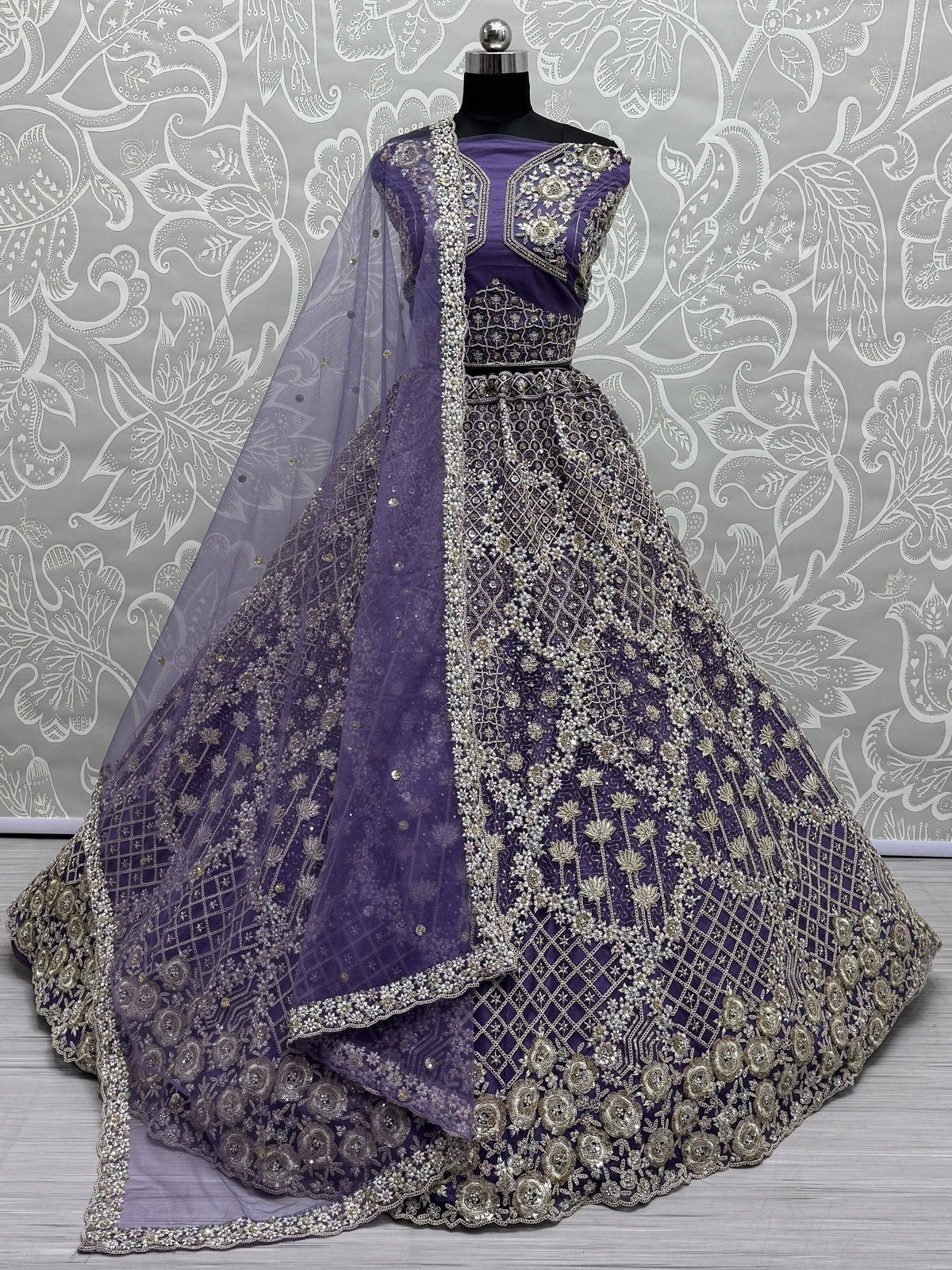 Purple designer lehenga choli with intricate gold embroidery and matching dupatta