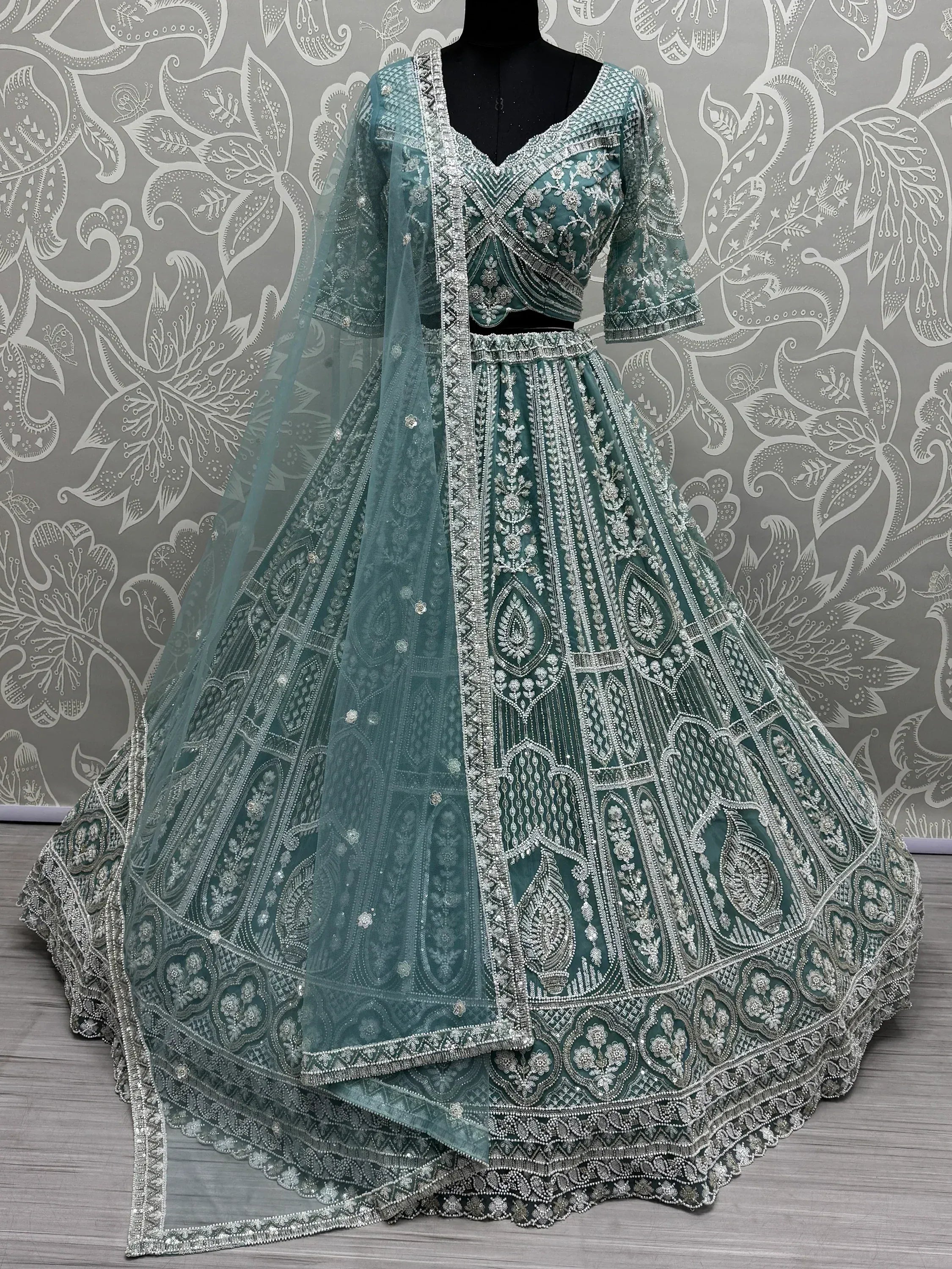 Teal designer lehenga choli with silver embroidery and net dupatta, ethnic Indian wear