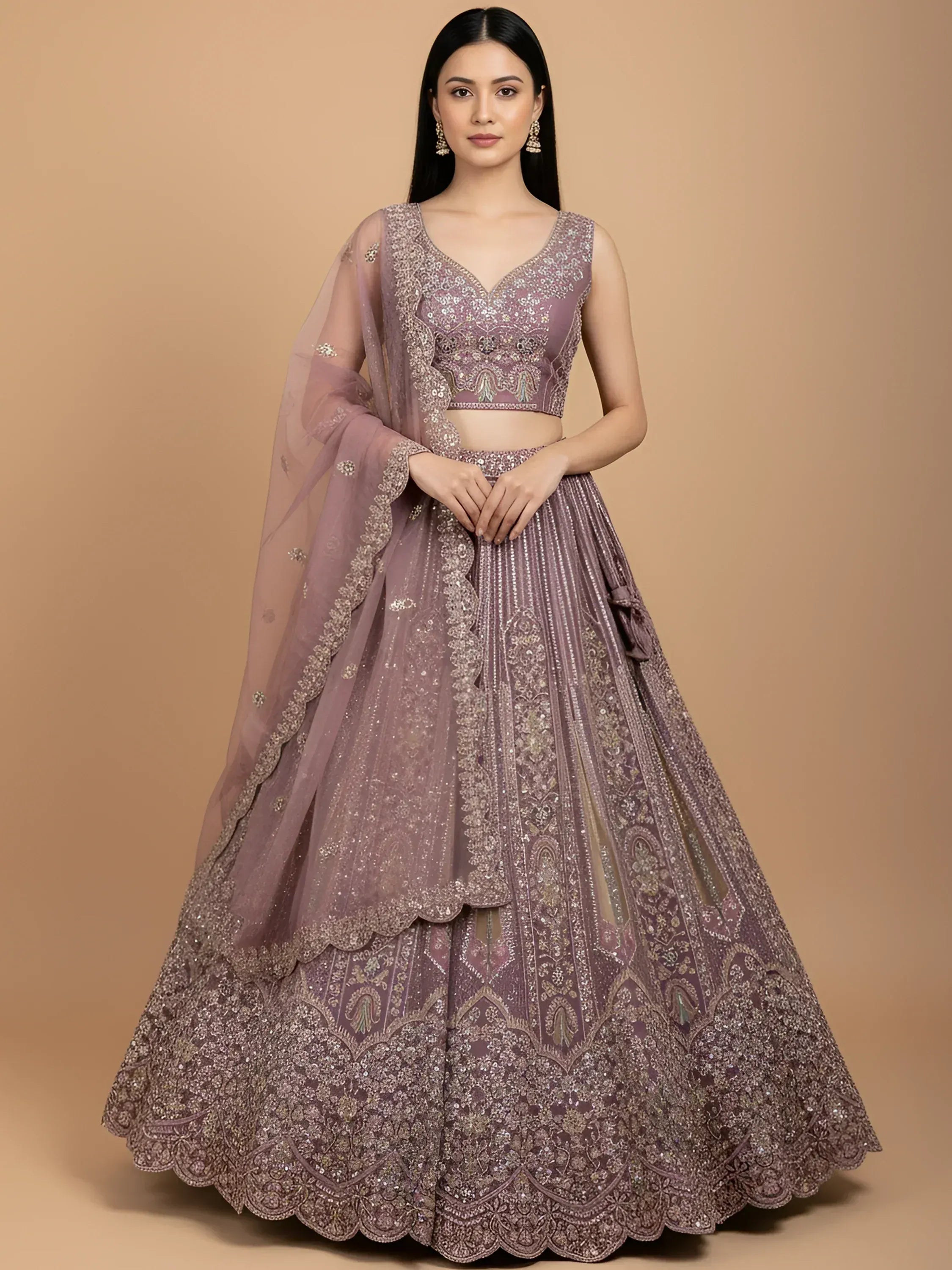 Elegant mauve lehenga choli with intricate embroidery and sequin work, perfect for Indian weddings and festive occasions.