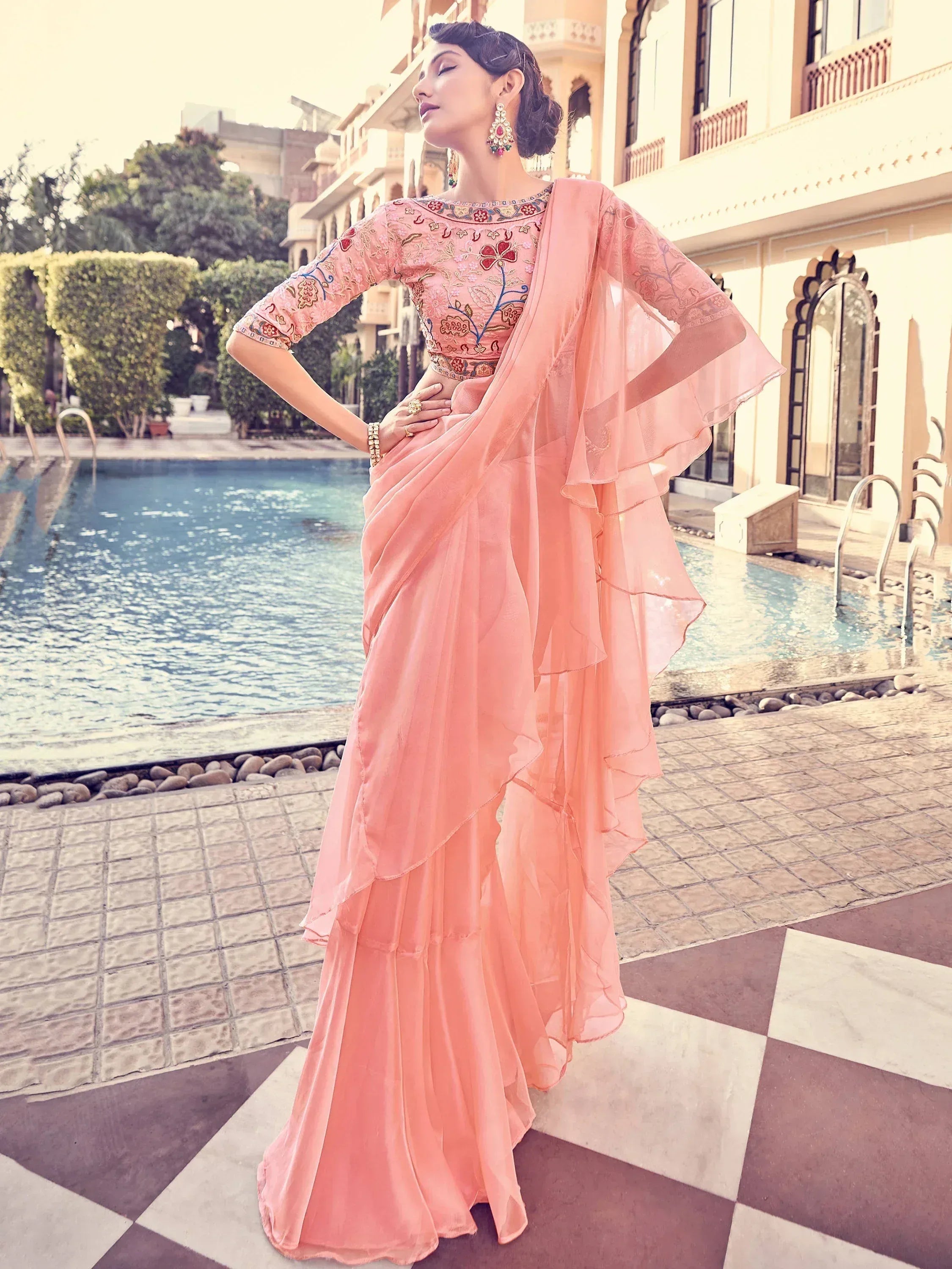Pink embroidered ethnic gown with ruffled dupatta, perfect for Indian occasions and parties