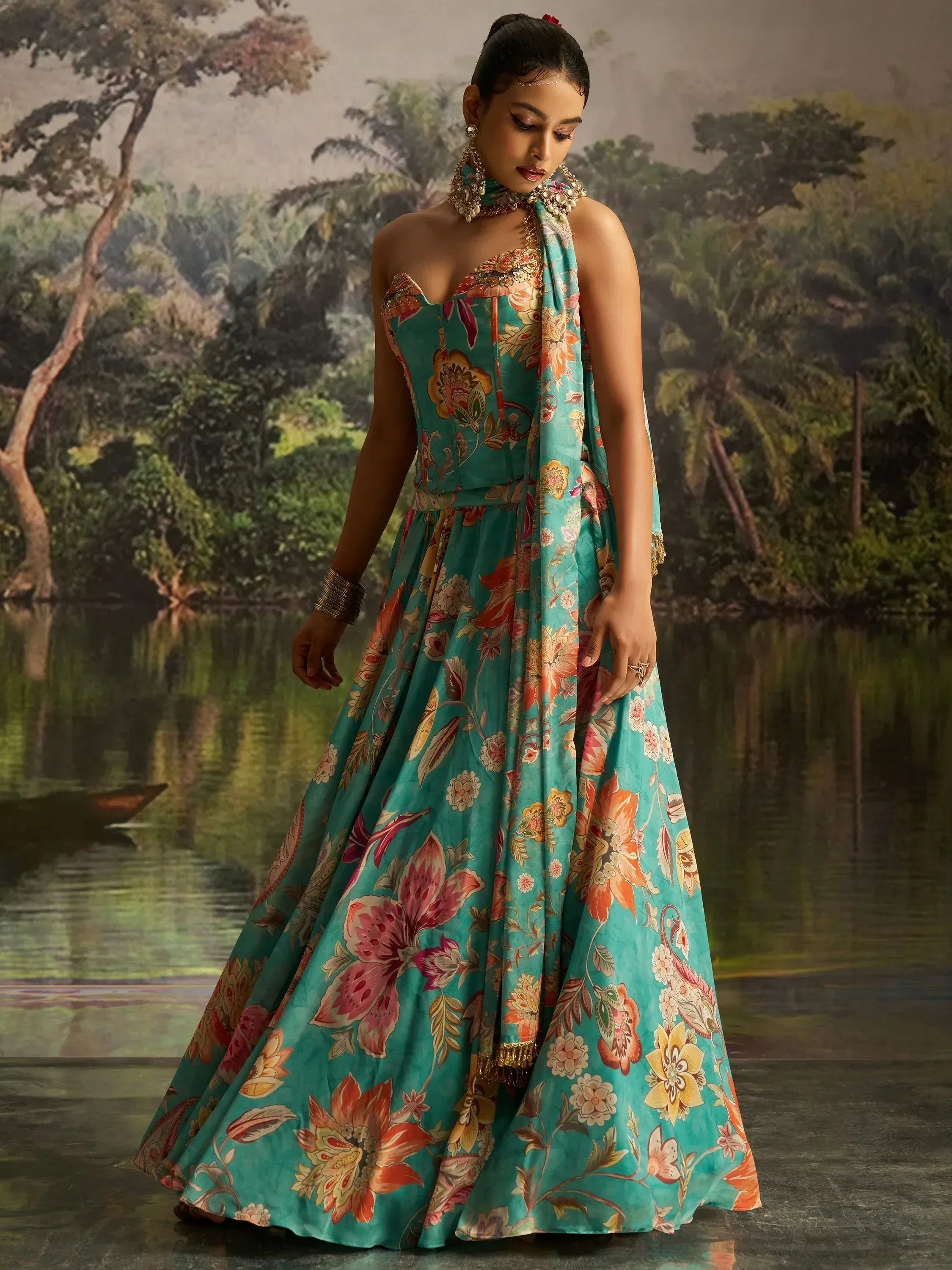 Teal floral print designer lehenga choli with halter neck, perfect for Indian ethnic wear occasions.