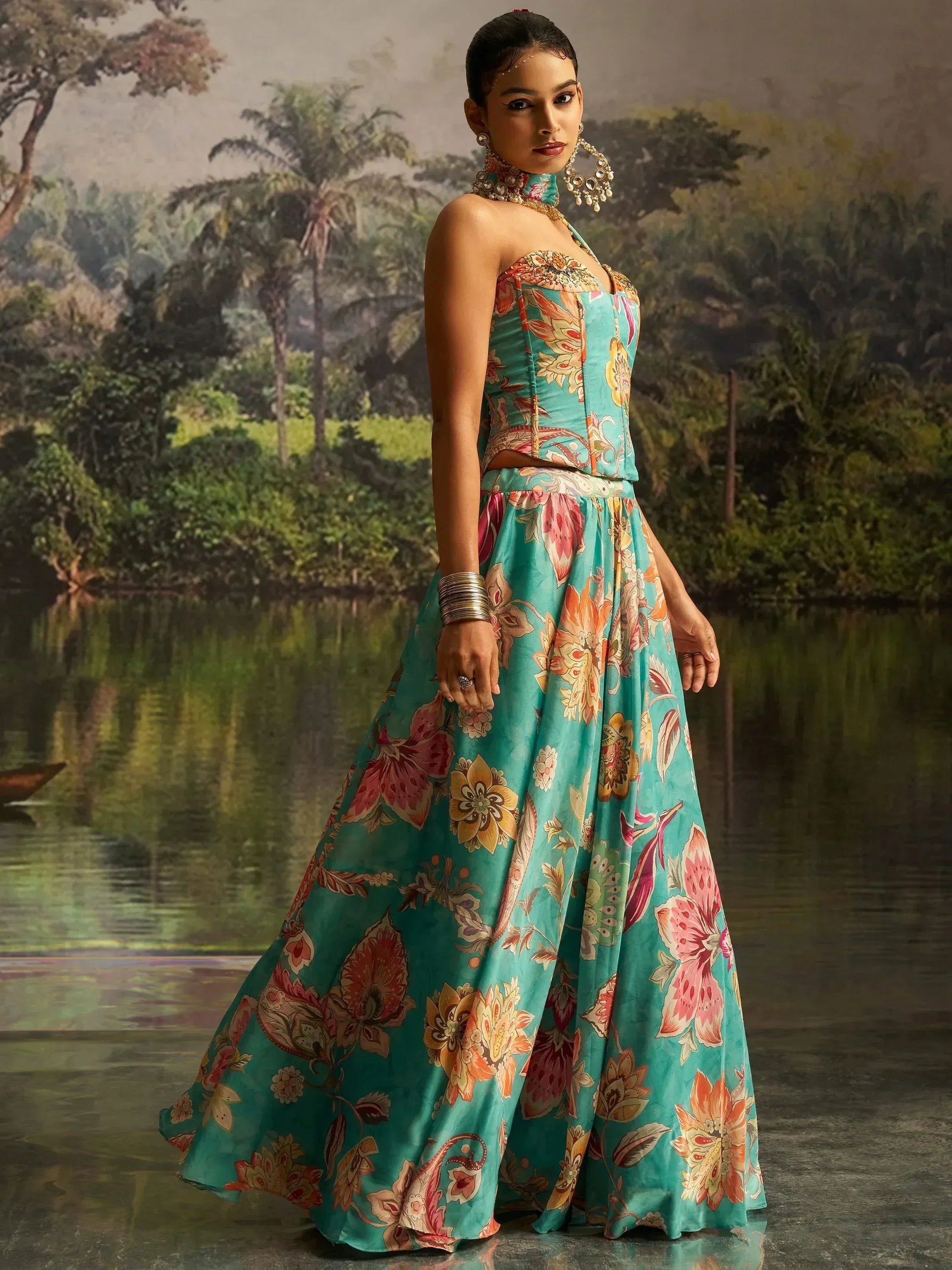 Teal floral print lehenga choli with halter neck, perfect for Indian ethnic occasions and weddings.