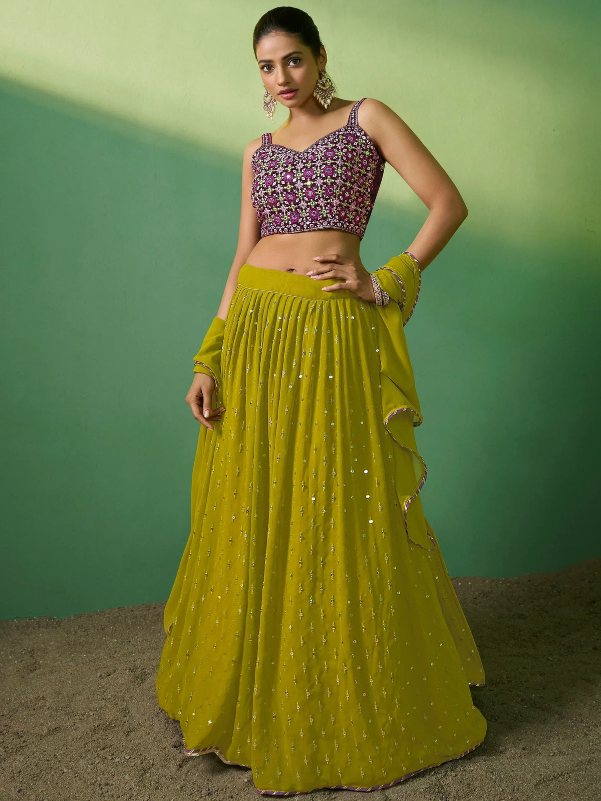 Yellow lehenga with sequin embellishments and floral embroidered purple crop top, perfect for Indian ethnic wear.