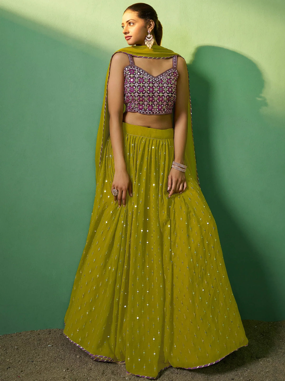 Elegant green lehenga choli with floral embroidery and mirror work, perfect for Indian ethnic wear.