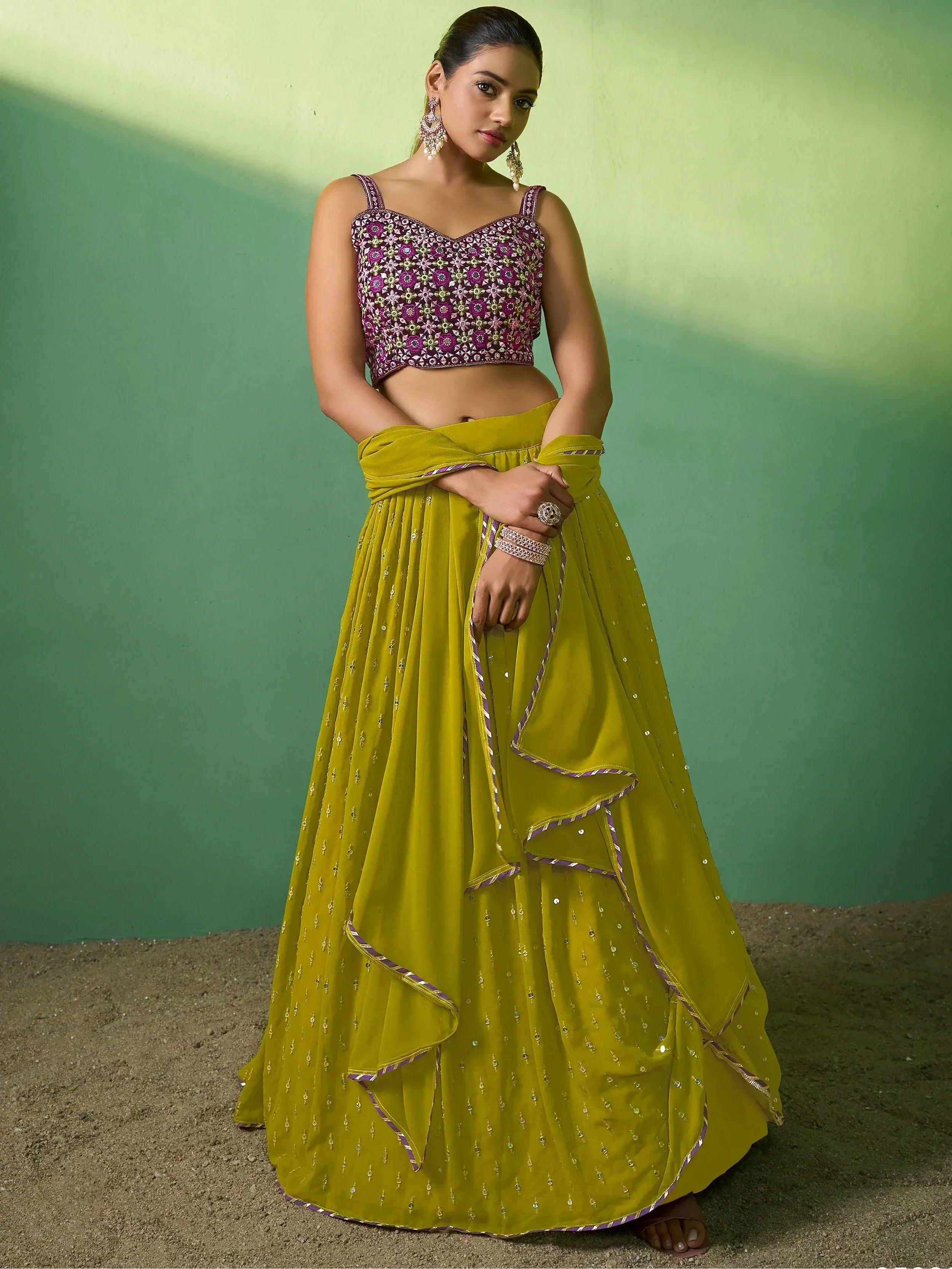 Elegant green lehenga with purple floral blouse, perfect for Indian ethnic wear events.
