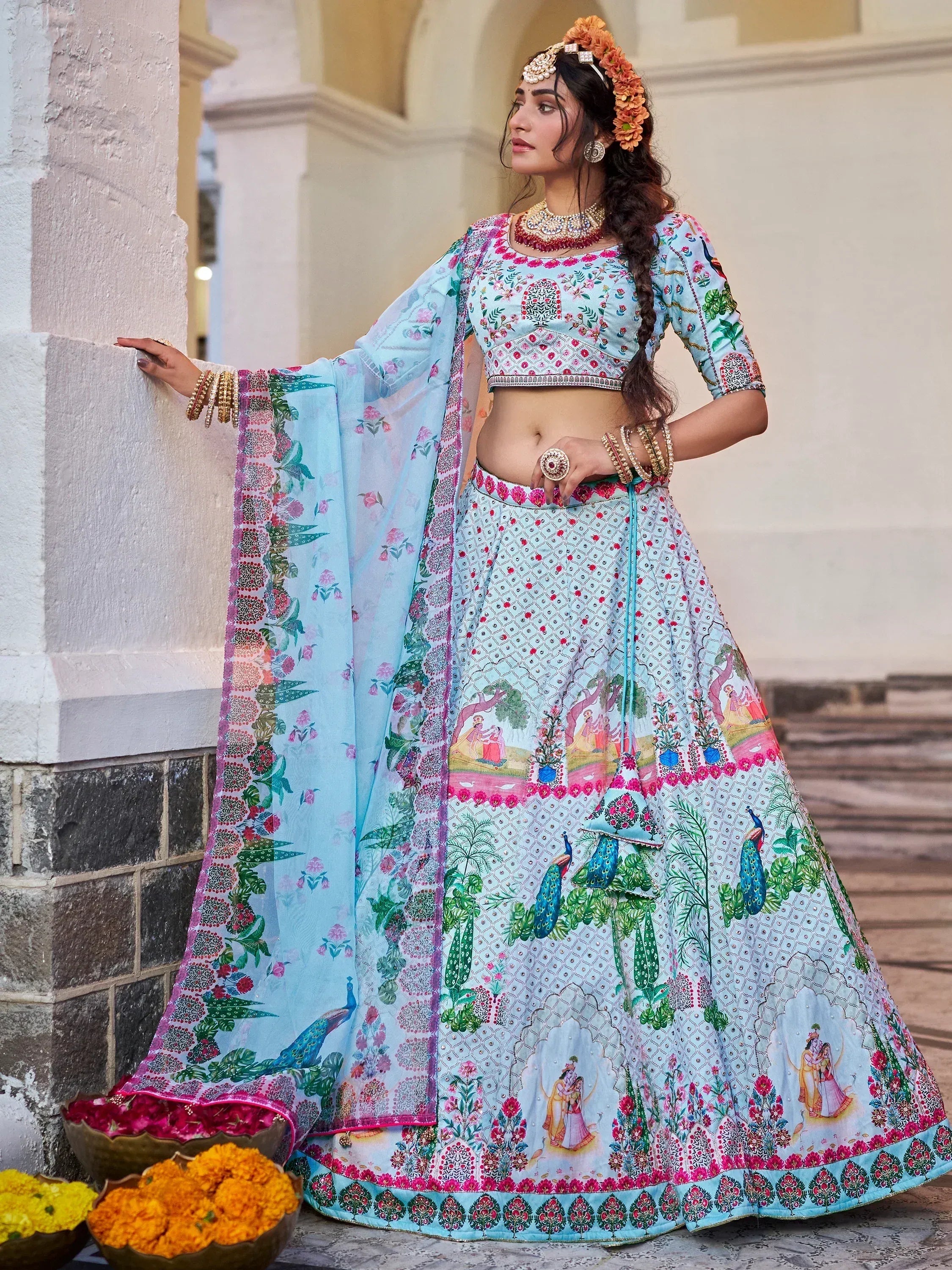 Light blue printed lehenga choli with peacock and floral motifs, perfect for Indian ethnic occasions